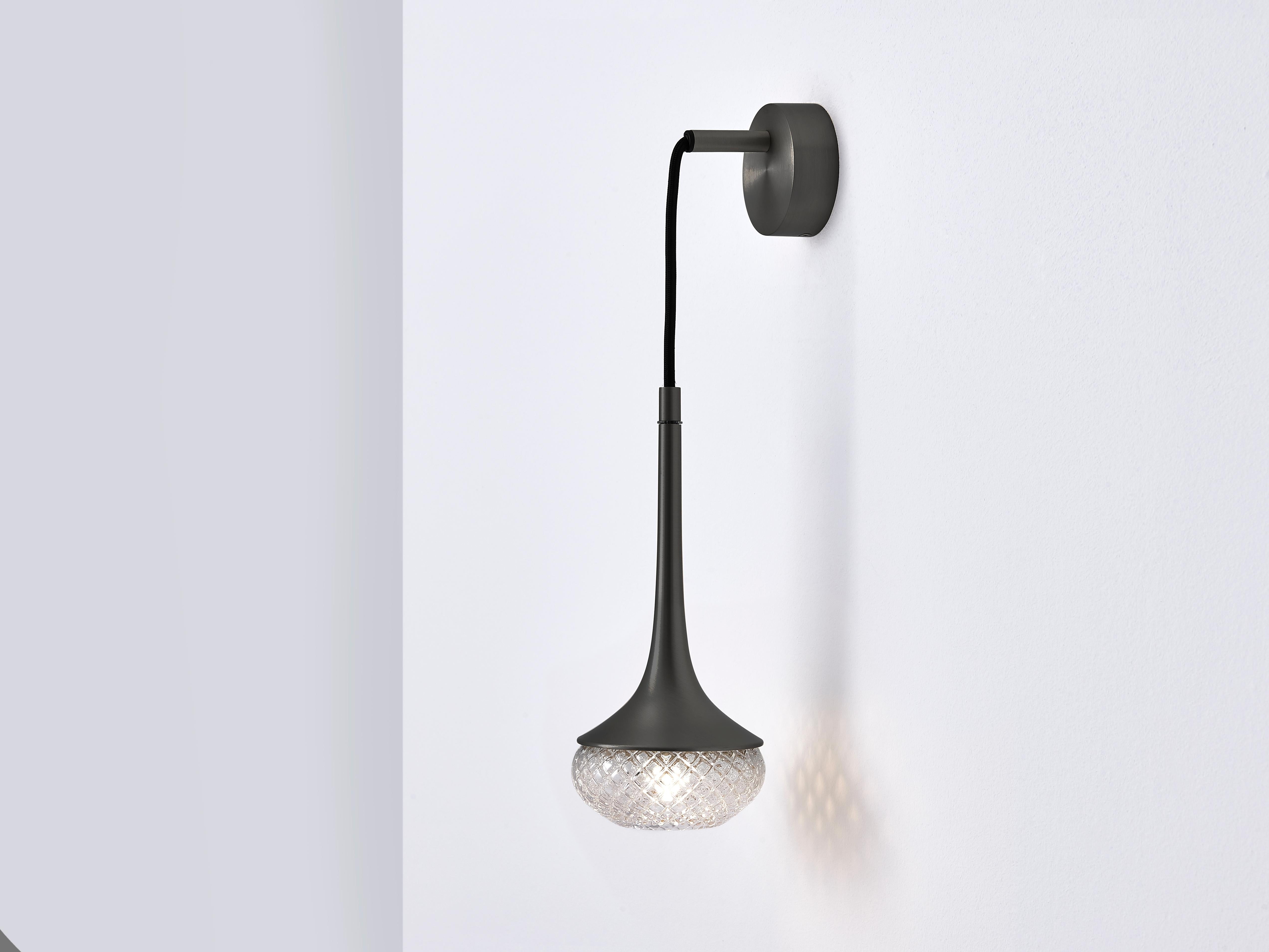 Flea brass wall light by Emilie Cathelineau
Dimensions: D11.5 x W15 X H33.5 cm
Materials: Solid brass,Mouth-blown glass,Textile cable
Others finishes and dimensions are available.

All our lamps can be wired according to each country. If sold