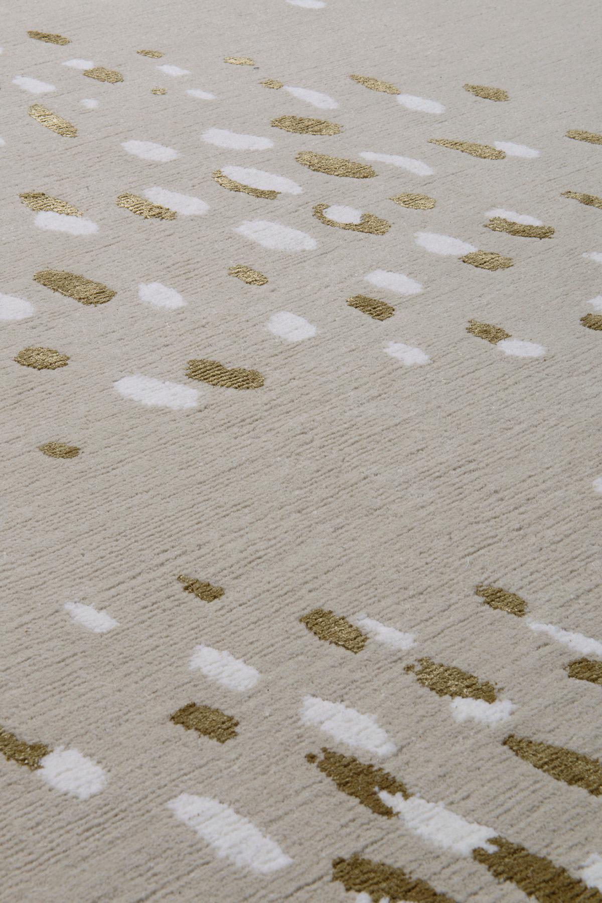 With a nod to the natural world, Fleck rug is reminiscent of a flock of birds in flight. The arrangement of freckles weave and swerve in union across the face of this design as they expand into abstract shapes. Crafted on a neutral wool background,