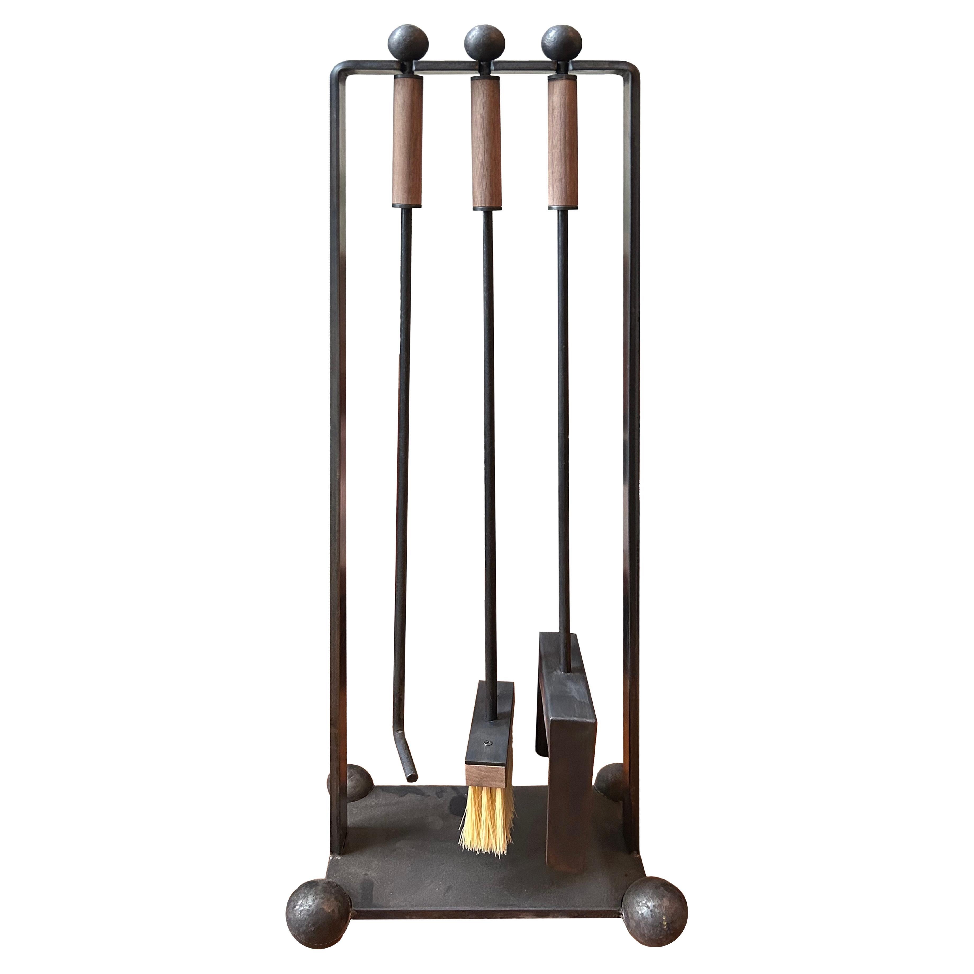 The Flecto Fireplace Tools by Austin, Texas–based studio Muhly blend function with decoration. The pared-back trio of tools are handmade, featuring walnut handles, ball feet, and a handmade natural Tampico brush.