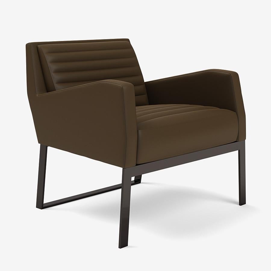 This Fleet Street lounge chair by Yabu Pushelberg is upholstered with quilted channels that are tufted in Ontario Street, pigmented nappa leather with natural grain. Ontario Street comes in 12 colorways from Germany, with a weight of