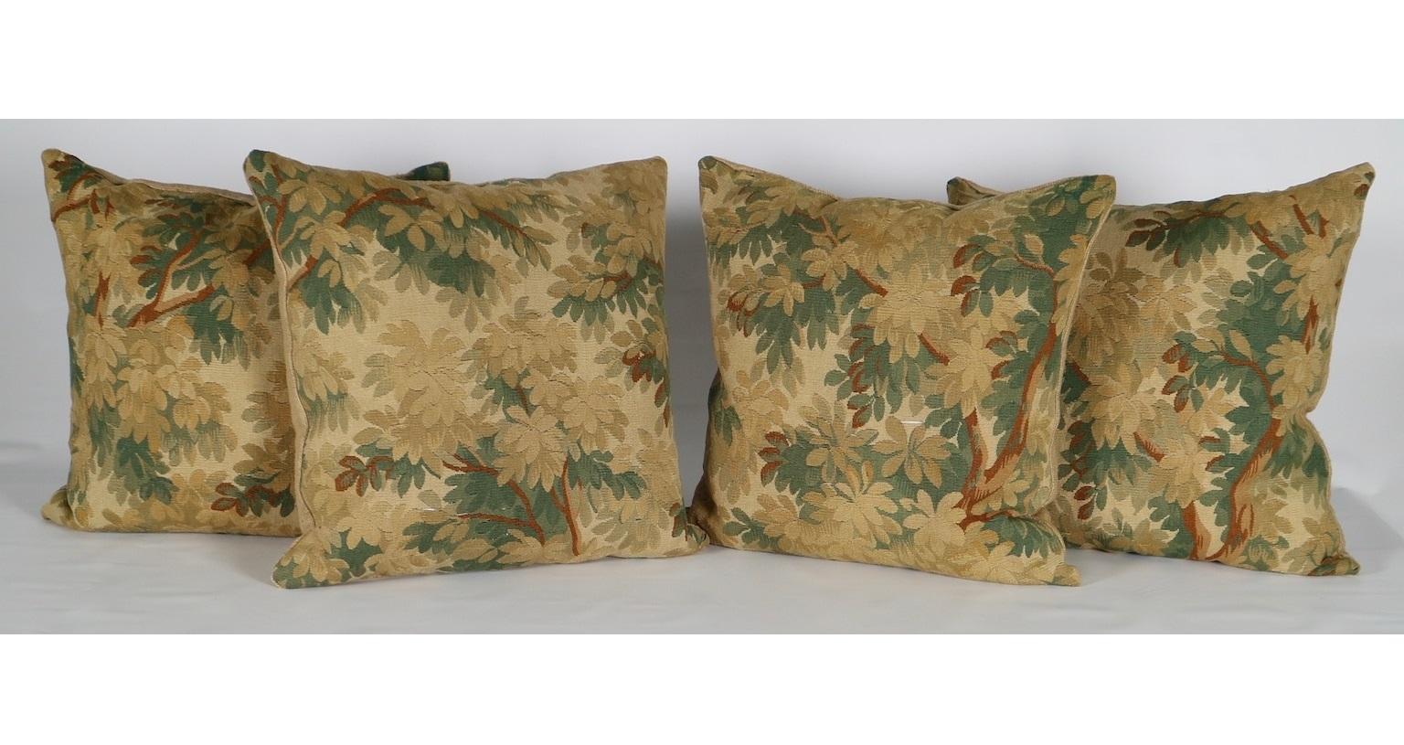 Set of five pillows made from 18th century Flemish verdure foliage tapestry, in handwoven wool and silk, with silk burlap back fabric. The set has three different sizes:
Four pillows in 24 in. x 24 in.
One pillow in 22 in. x 22 in.
One pillow in