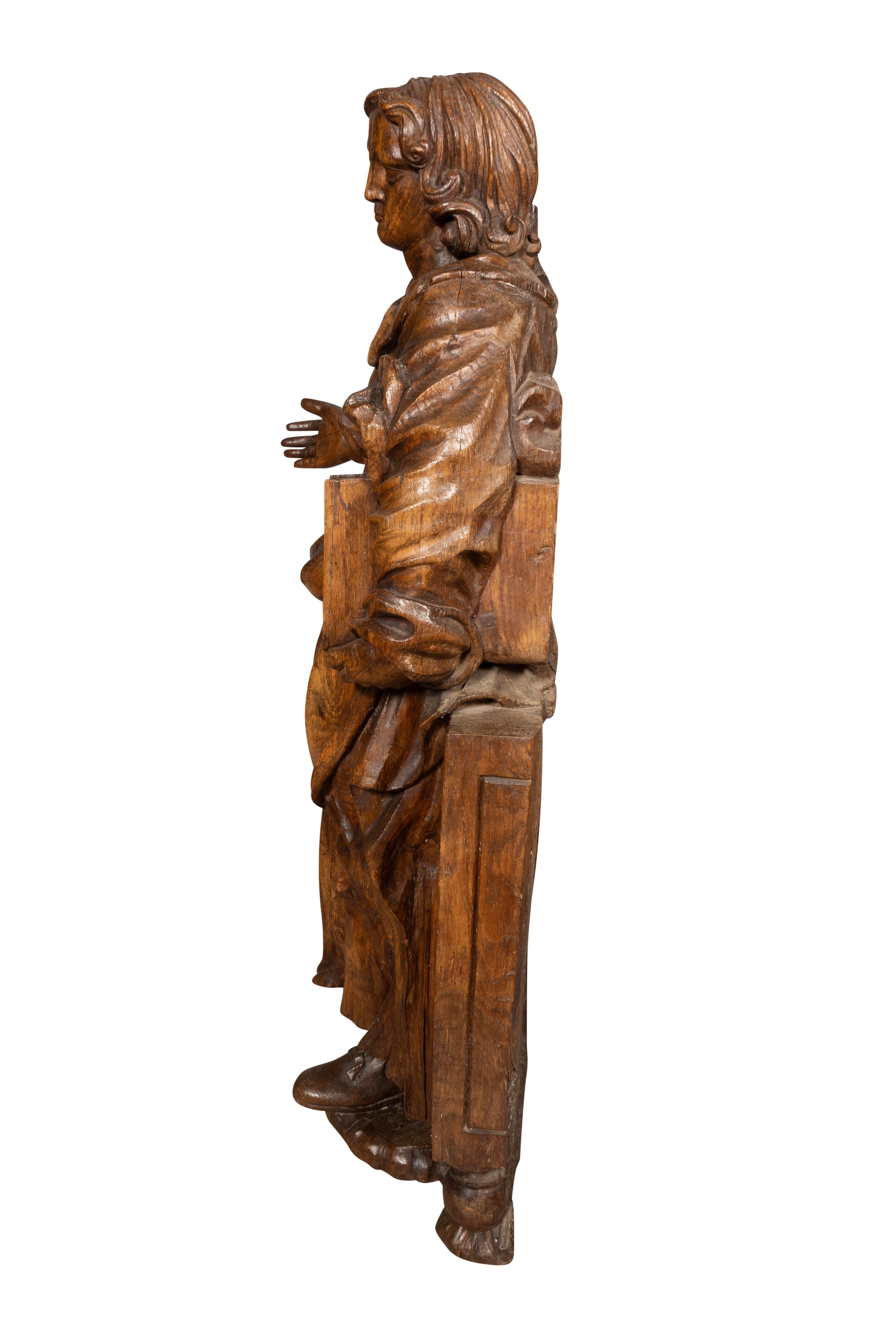 Mid-17th Century Flemish Baroque Carved Oak Figure Of A Scholar For Sale