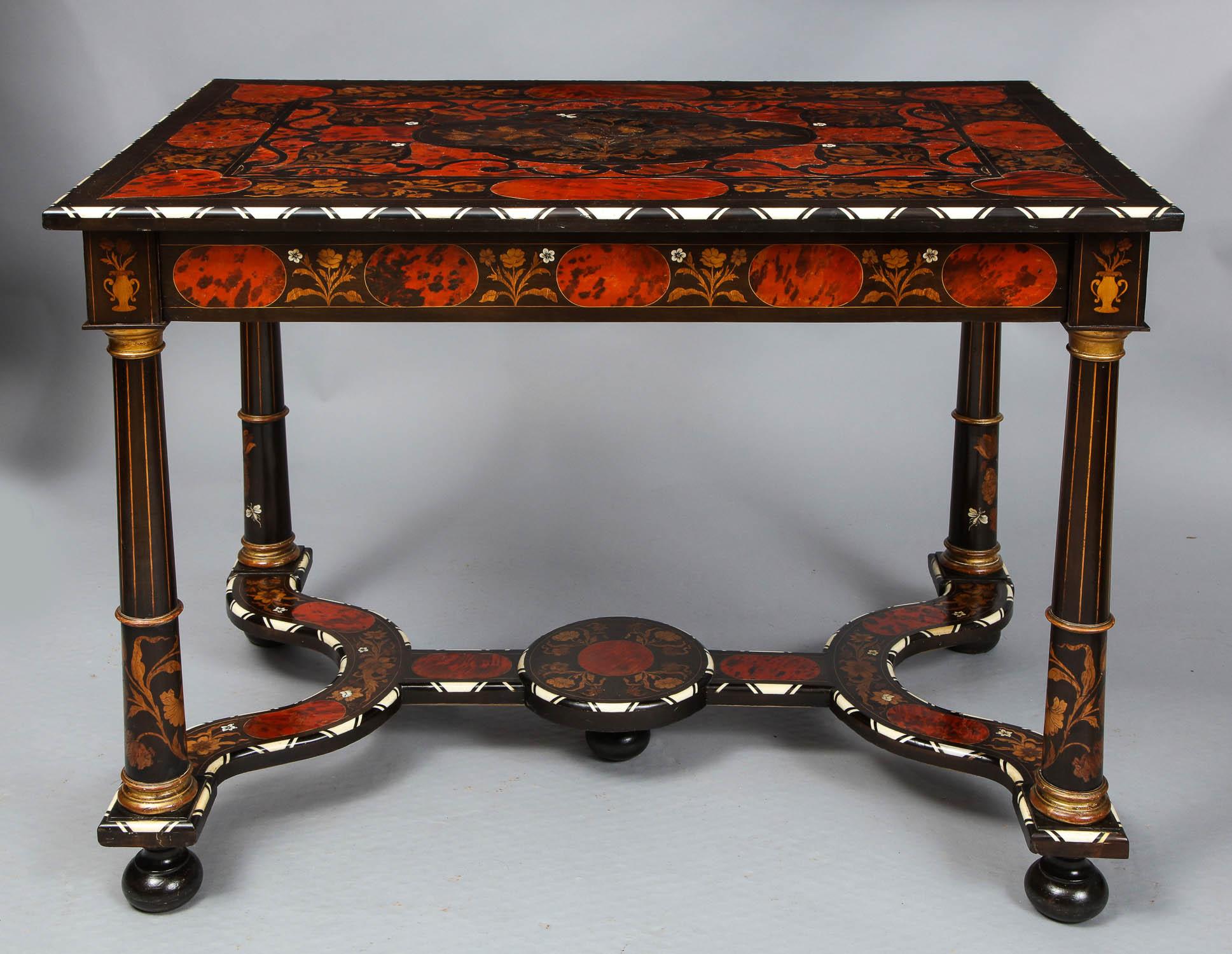Very fine 19th century Flemish ebony center or writing table having floral marquetry inlay inlaid bone insects on a walnut, ebony and faux tortoise background, bone and ebony patterned moldings, with the legs with gilt capitals and bases, standing