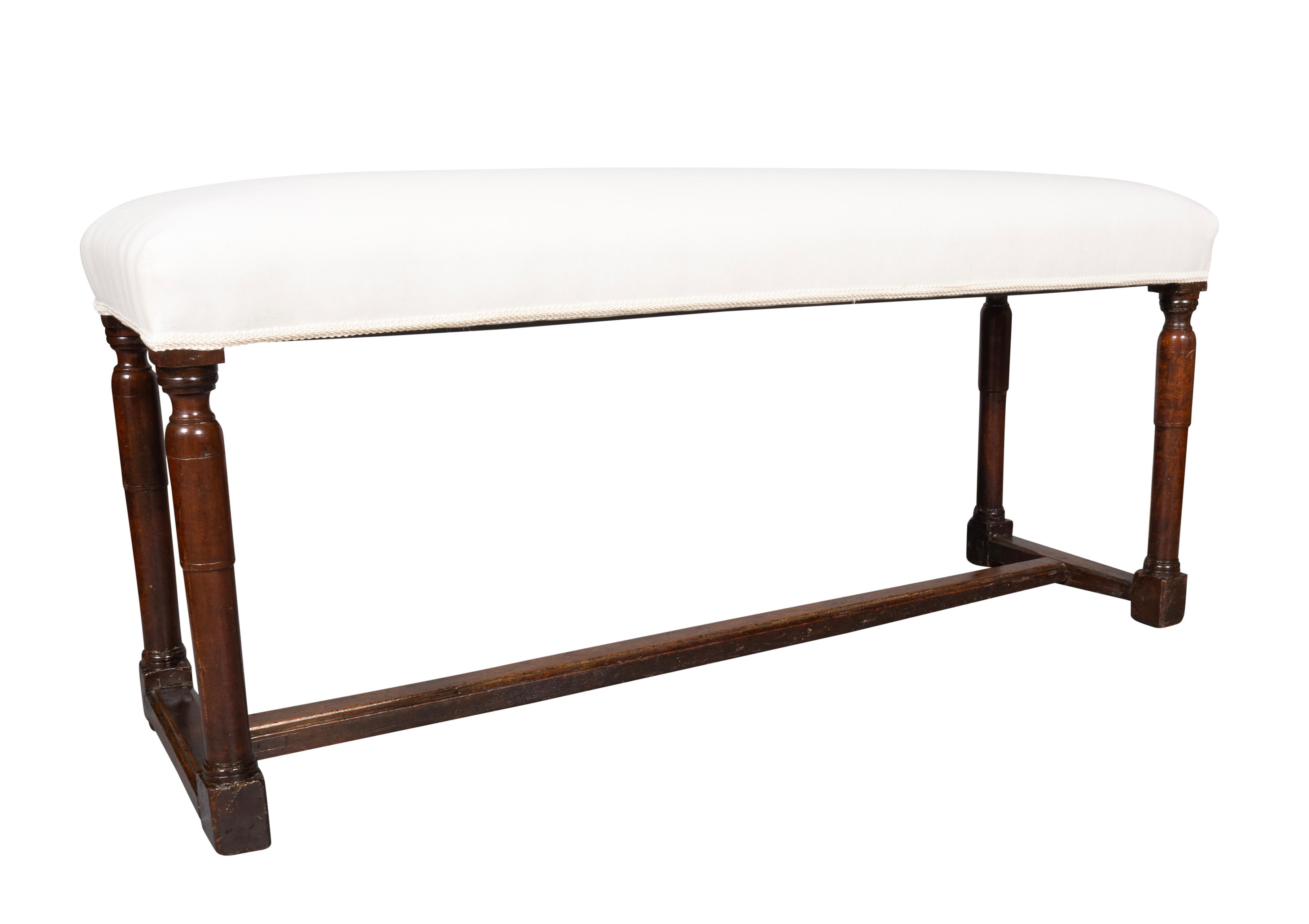 Newly reupholstered with muslin. Turned legs with H form stretcher.