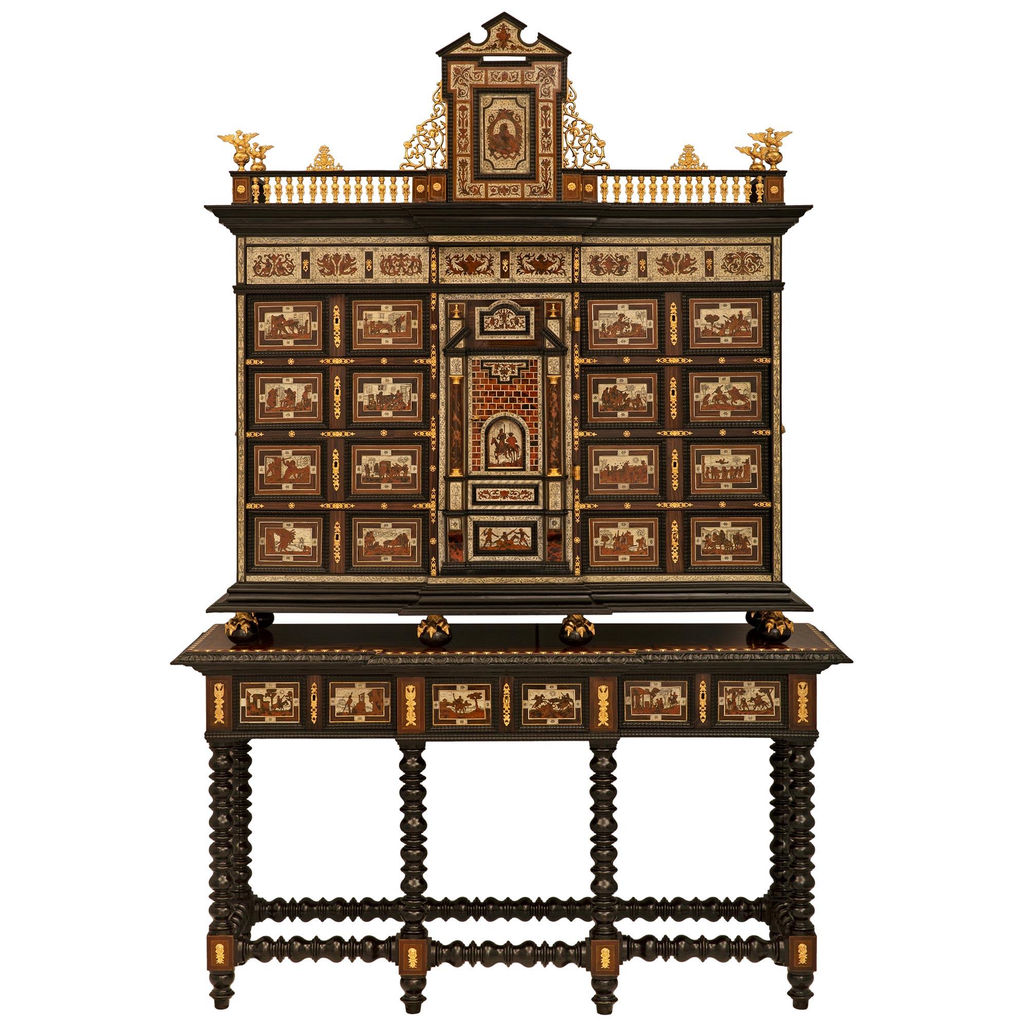A spectacular and large scale Flemish early 19th century Rosewood, Mahogany, Ebony, ivory, Tortoiseshell and ormolu specimen cabinet. The fifteen drawer one door cabinet is raised by its original base with six exceptional most decorative turned legs