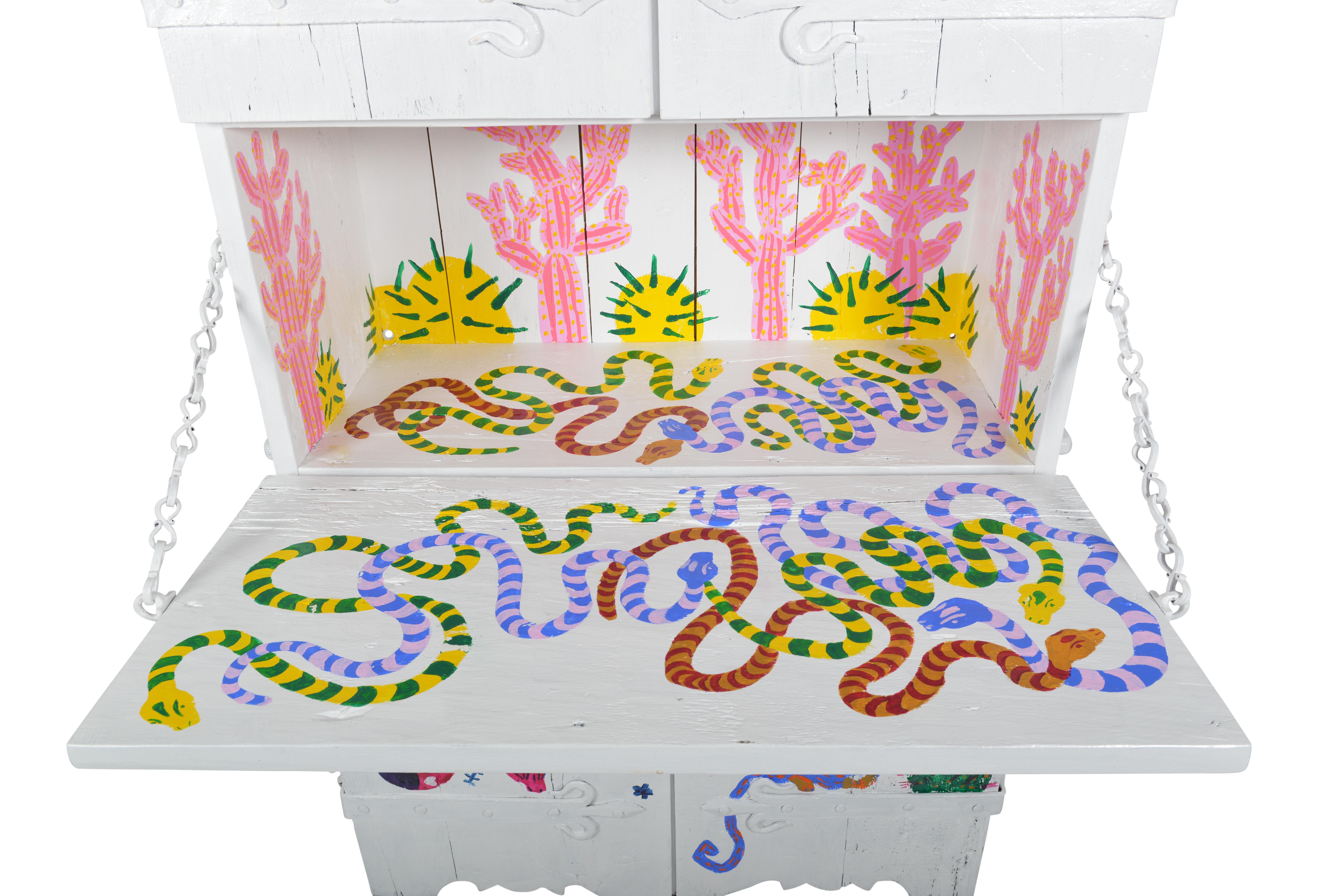 We commissioned the lovely young artist Esther Cornelis to paint a very colourful and phantasmagorical flora and fauna on an old Arts and Crafts scriptor. The escritoire is in the local Flemish gothic revival style and made of oak and forged iron