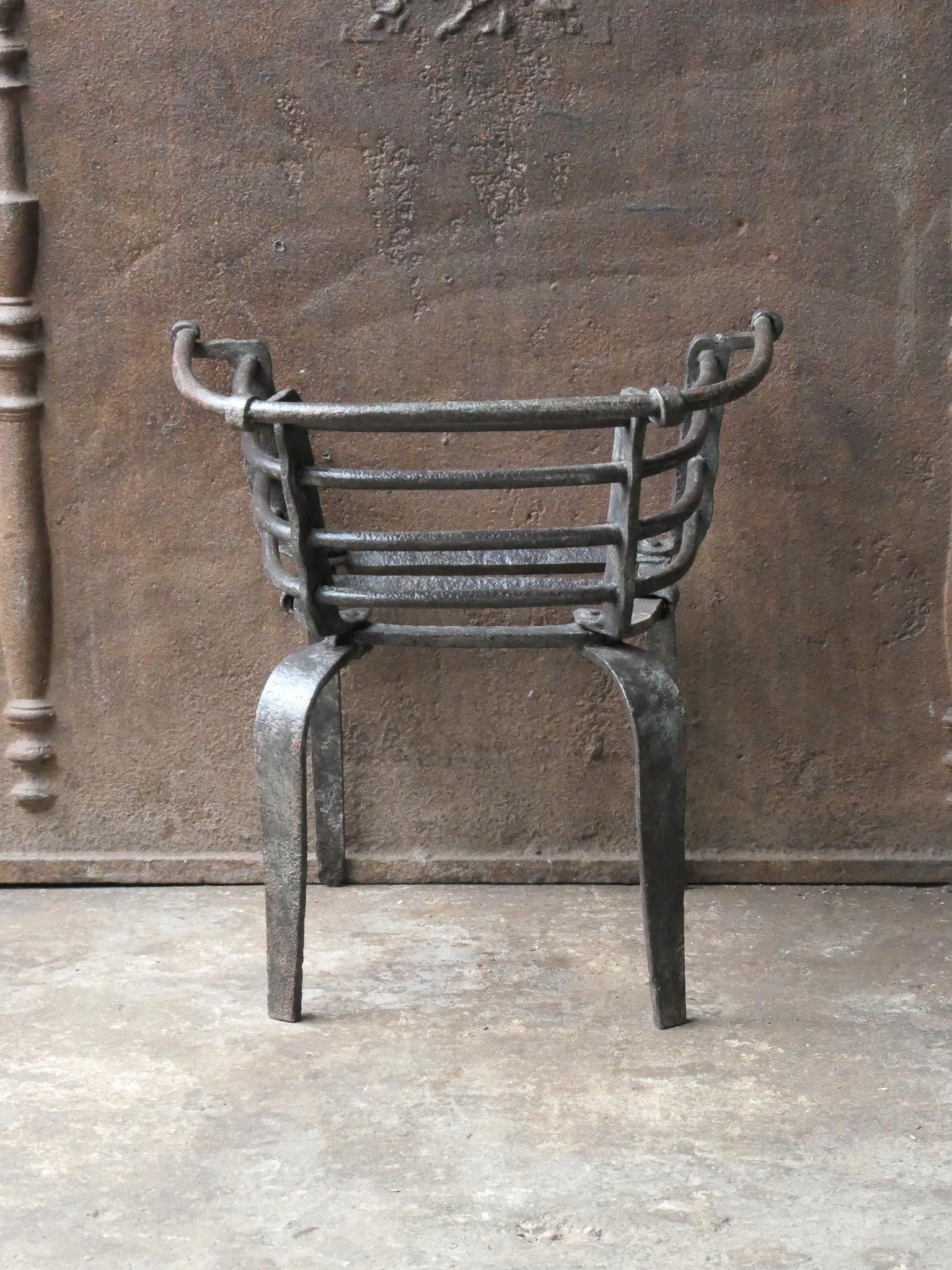 17th century Flemish Louis XIV period fireplace grate. Made of beautifully forged wrought iron. The condition is good.






  