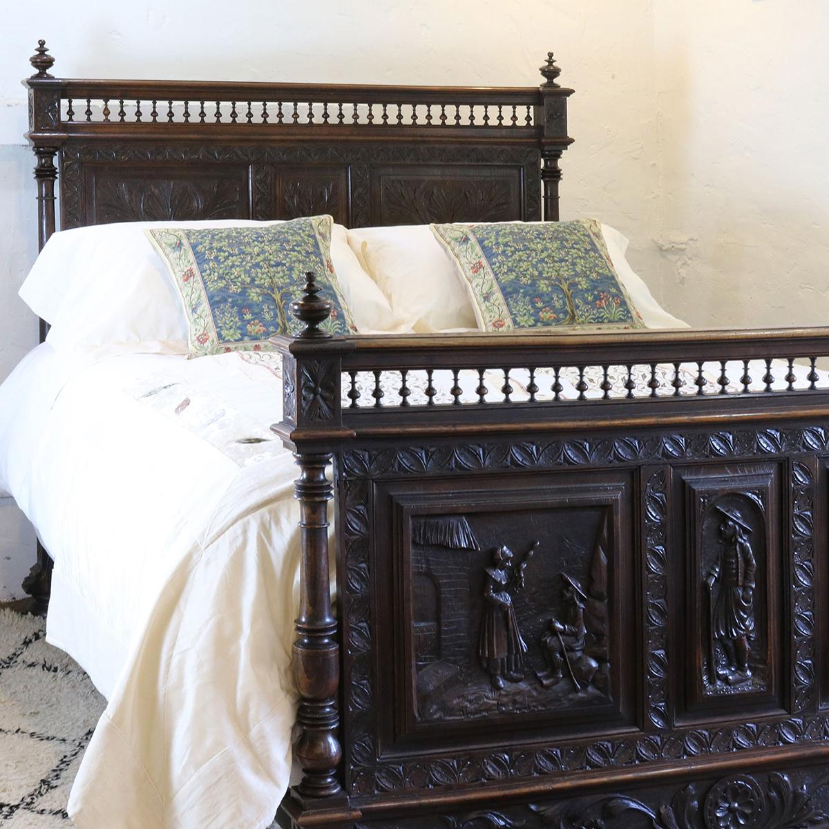 Oak Flemish bed with richly carved panels and scenes depicting rural life.

The bed accepts a British king-size or American queen-size (60 inches, 5ft or 150cm wide) base and mattress.

The price is for the bed frame alone. The base, mattress,