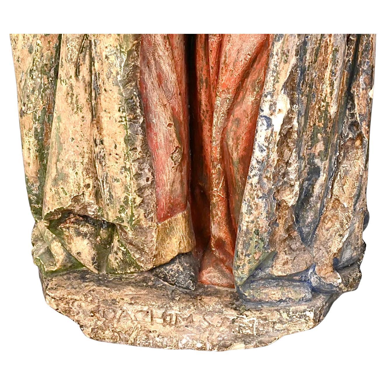 Escultura flamenca policromada del Encuentro de San Joaquín y Santa Ana. Fundición de arenisca sobre piedra caliza que representa el abrazo de San Joaquín y Santa Ana en el Golden Gate tras la noticia de la inmaculada concepción de la Virgen María,