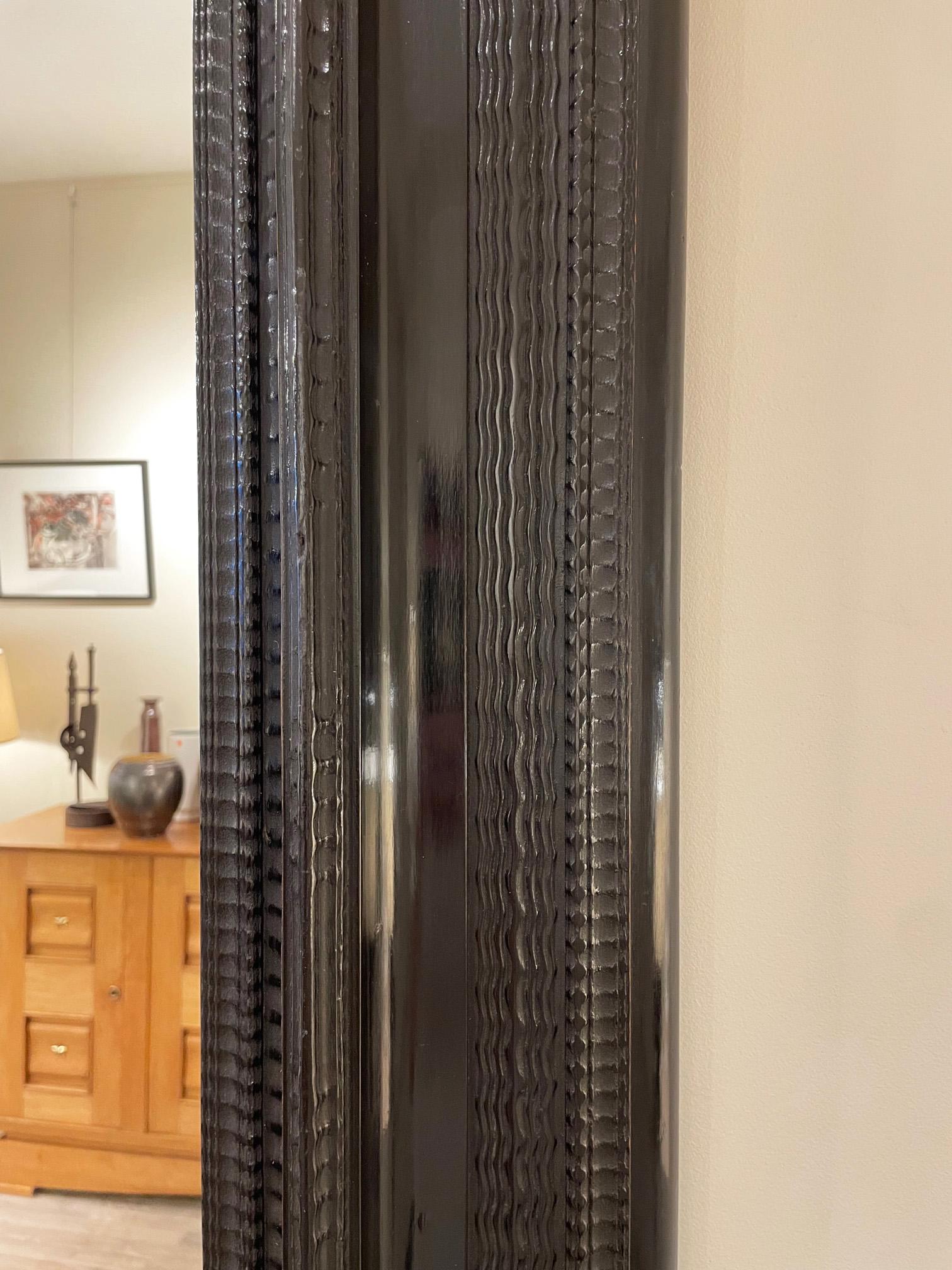 20th Century Flemish Style Ebonised Ripple Frame Mirror