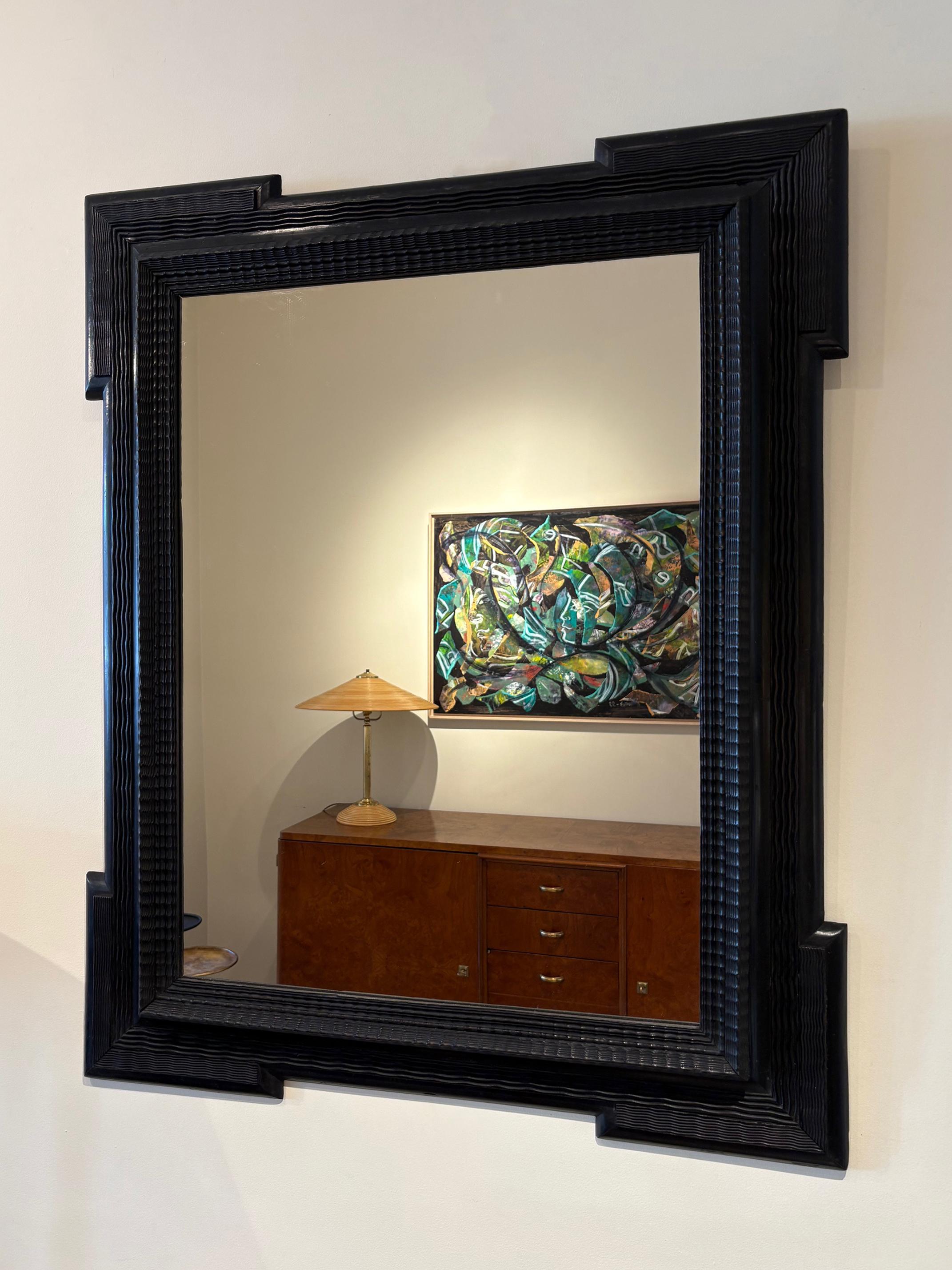 A Flemish style ripple frame mirror
Italy, Circa 1900
New mirror glass and backing.
