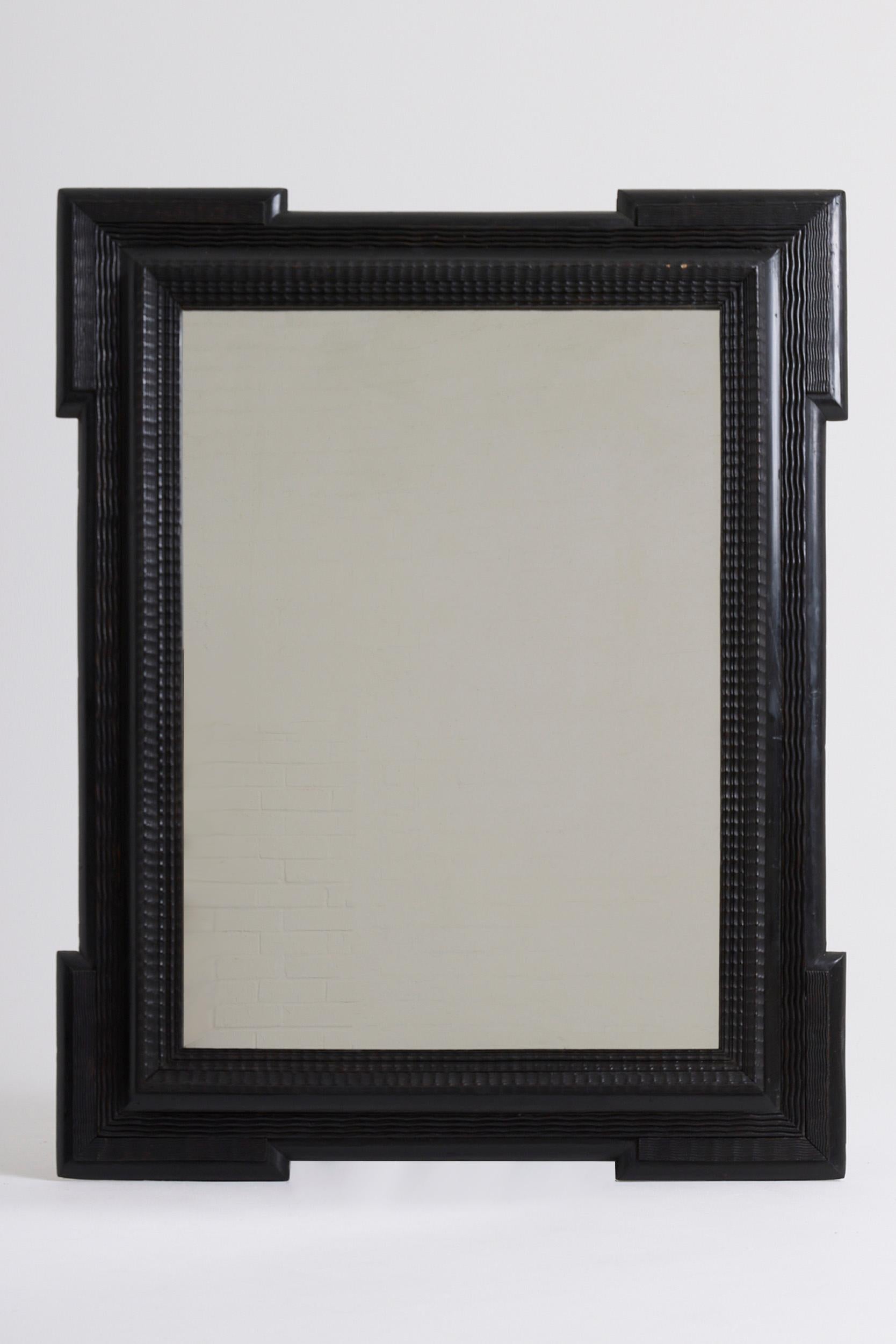 A Flemish style ripple frame mirror
Italy, Circa 1900
New mirror glass and backing.
