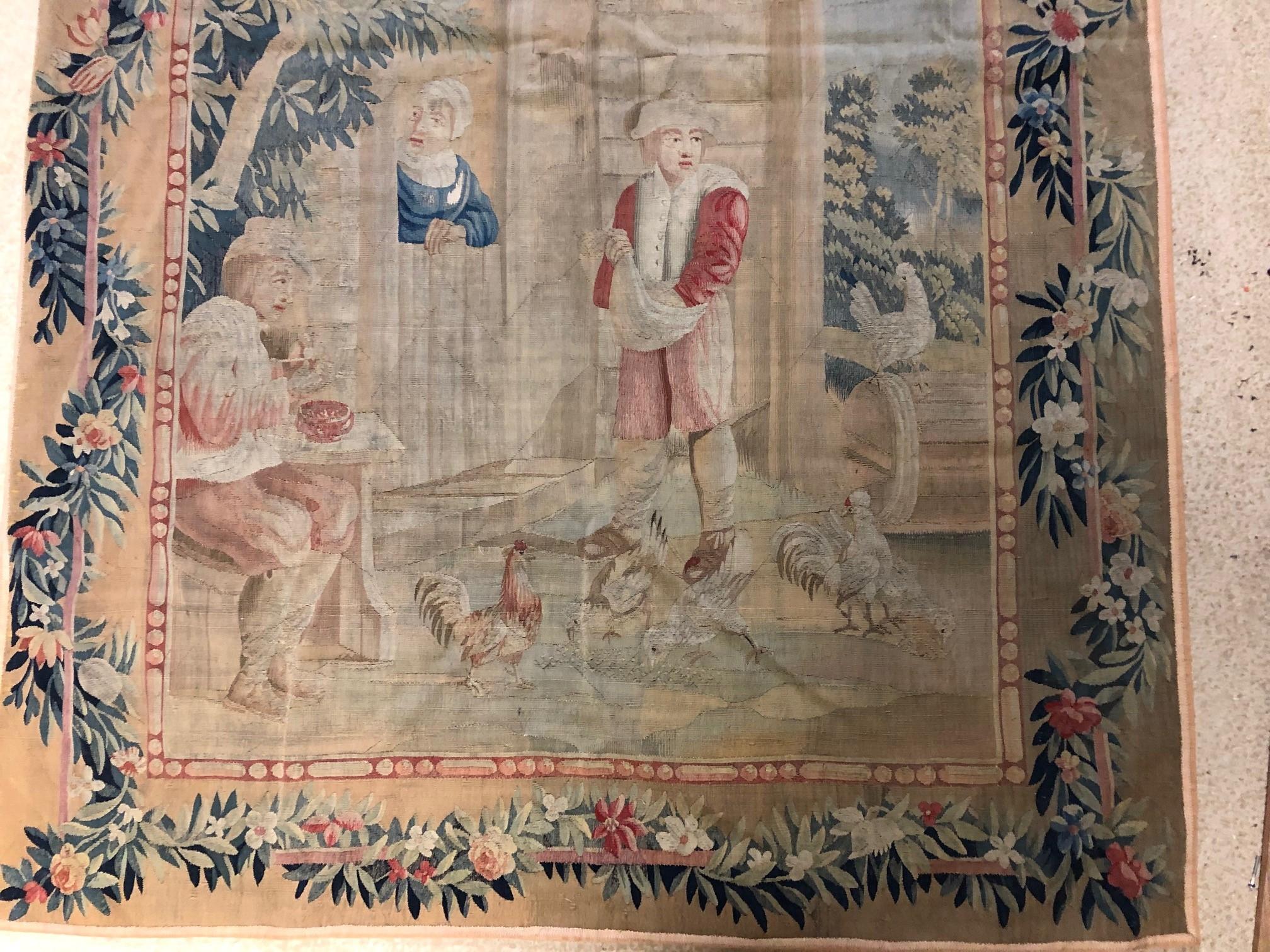Flemish Tapestry 
With complete floral border
Wool and silk
Lined

After a painting by David Teniers the Younger (1610-1690), this tapestry is from the second quarter 18th century, Brussels .
In the 18th century, it was very exclusive to own a
