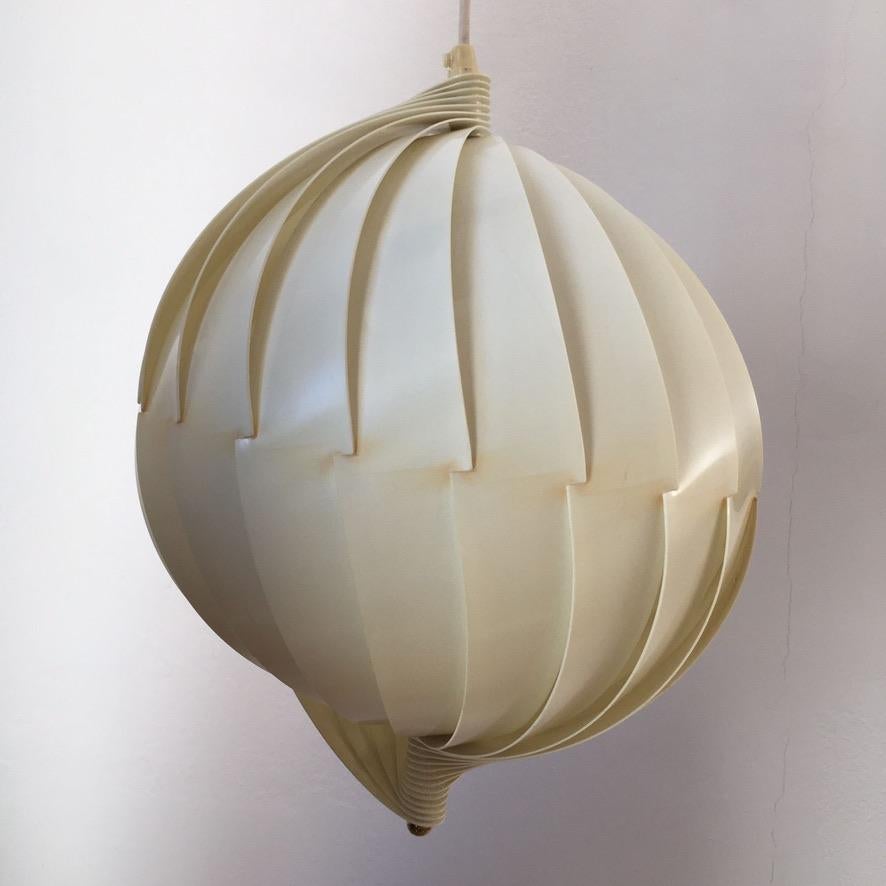 Scandinavian Modern pendant lamp designed in the 1960s by Flemming Brylle and Preben Jacobsen, Denmark. This lamp is made of many strips of light diffusing antistatic polyacrylic that interlock to from a shell-like shape.