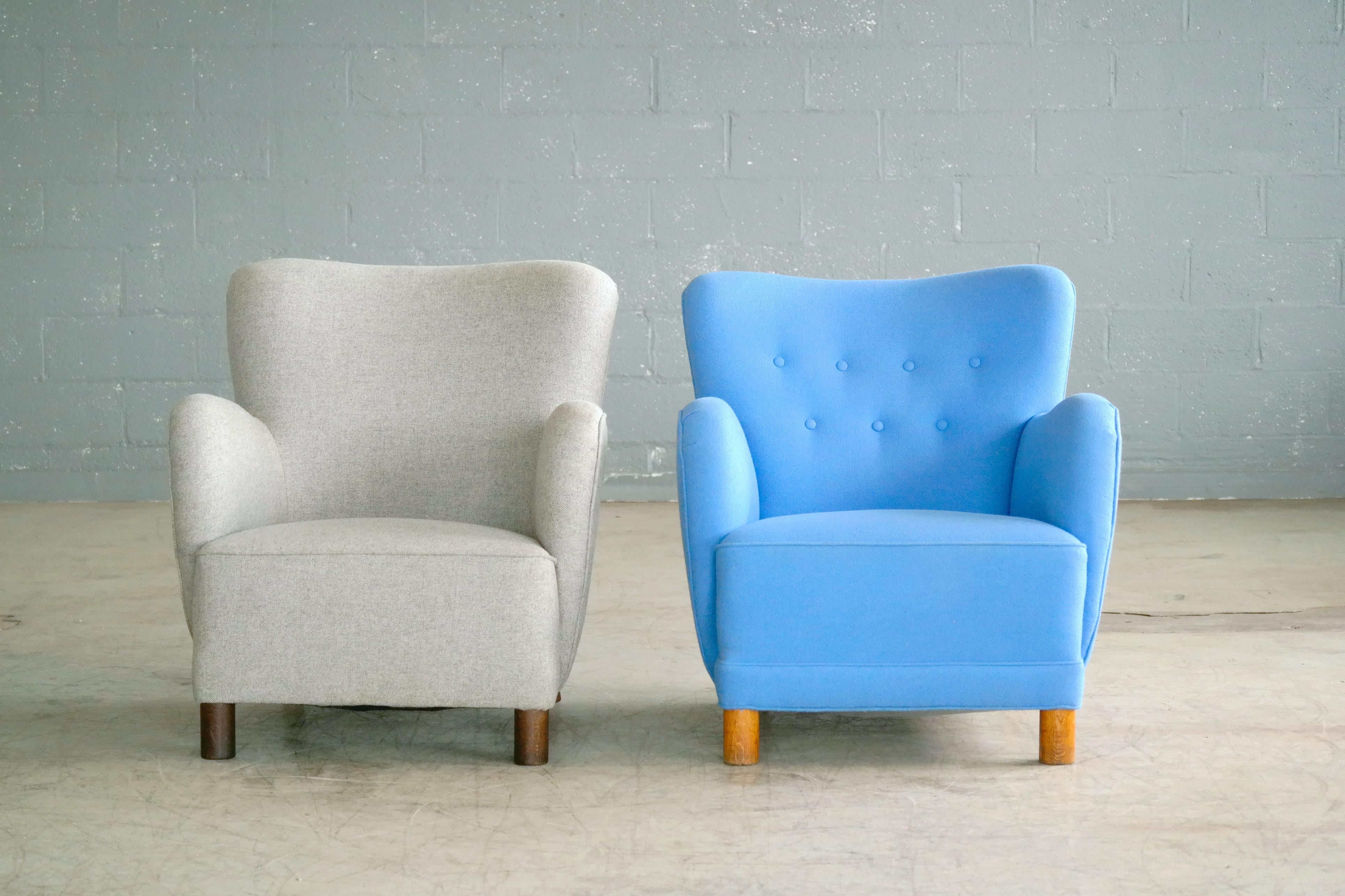Rare to find Mogens Lassen attributed pair of lowback club chairs from the 1940s featuring the rounded armrest design and the cylindrical front legs that are very characteristic of Lassen. Lassen's unique style is increasingly coveted and copied and