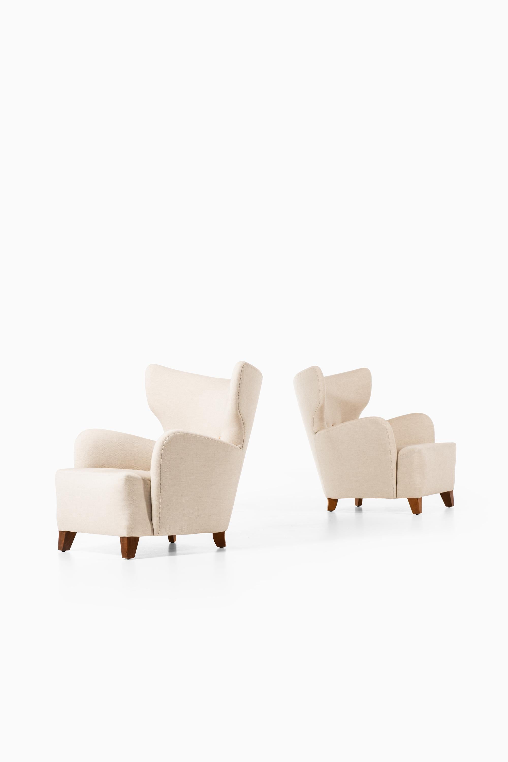 Danish Flemming Lassen Attributed Pair of Wingback Easy Chairs Produced in Denmark