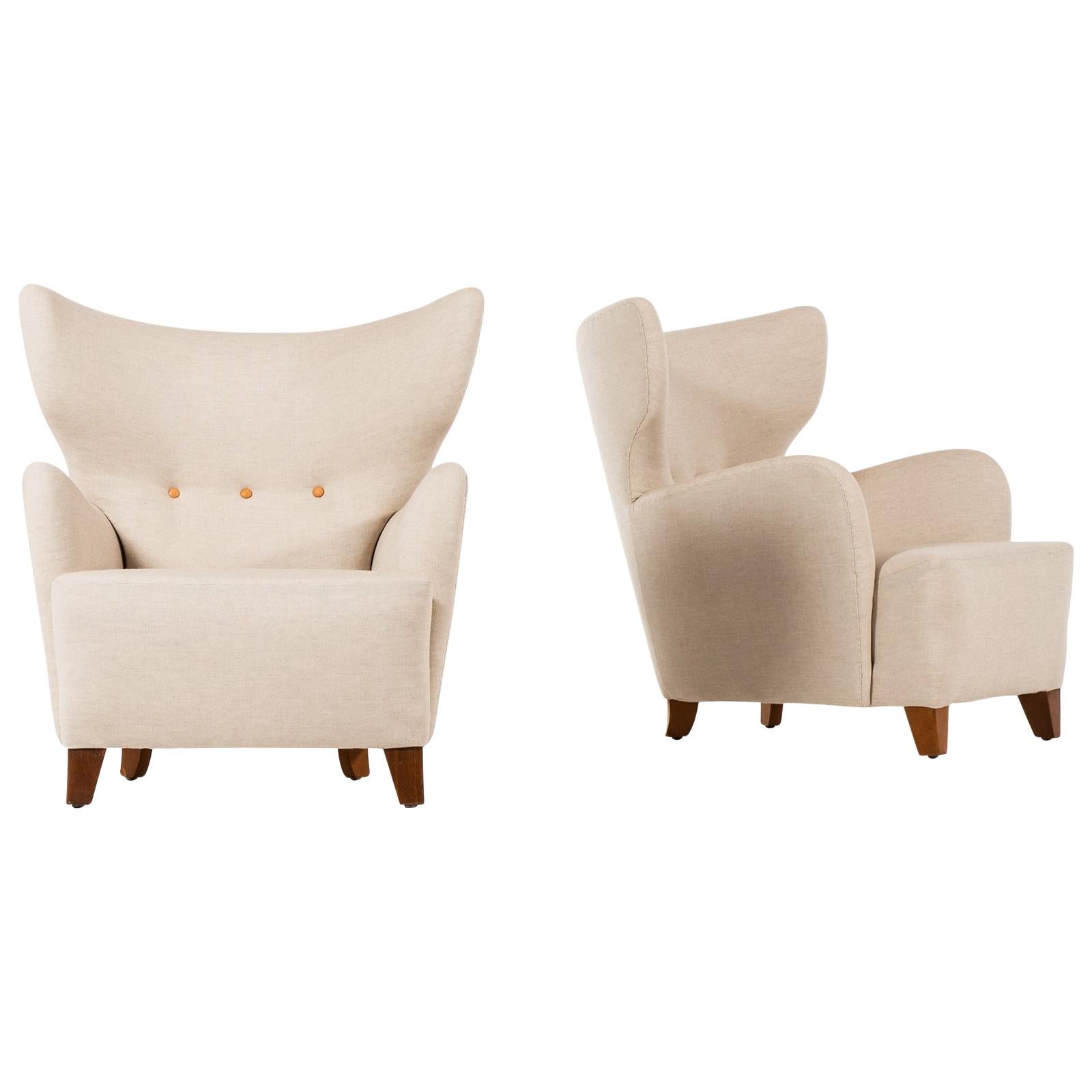 Flemming Lassen Attributed Pair of Wingback Easy Chairs Produced in Denmark