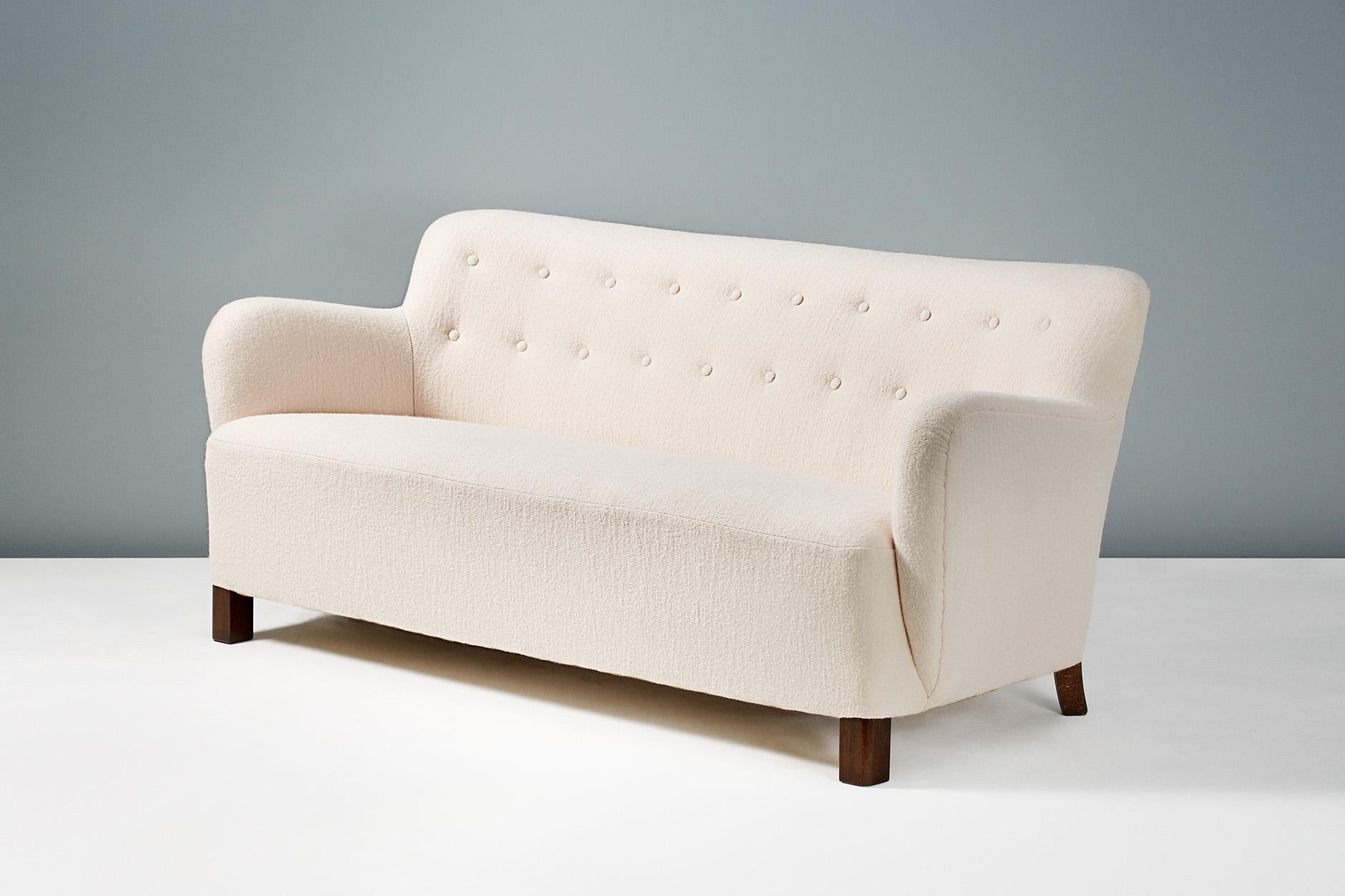 Flemming Lassen (attributed)

Sofa, circa 1940s

Small sofa attributed to Flemming Lassen, Denmark. Stained beech legs with new pale wool fabric upholstery from Chaise Erwin. 

Measures: H 71cm, D 80cm, W 166cm..
               