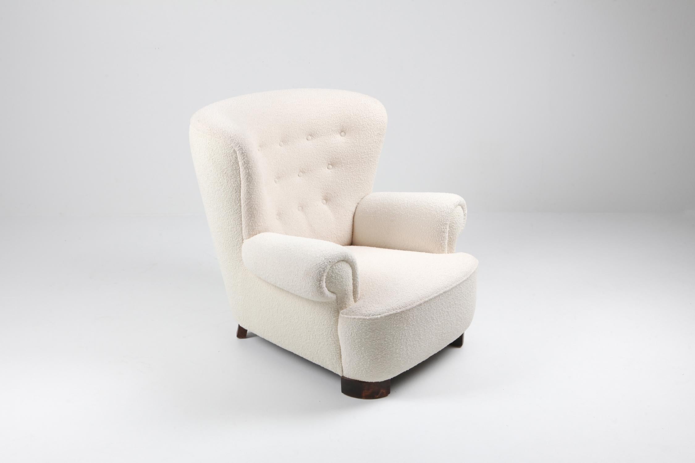 Scandinavian Modern lounge armchair, in the style of Flemming Lassen.
With extravagant wingback for a grand interior.
upholstered in a top quality bouclé wool

Danish Mid-Century Modern design.


   