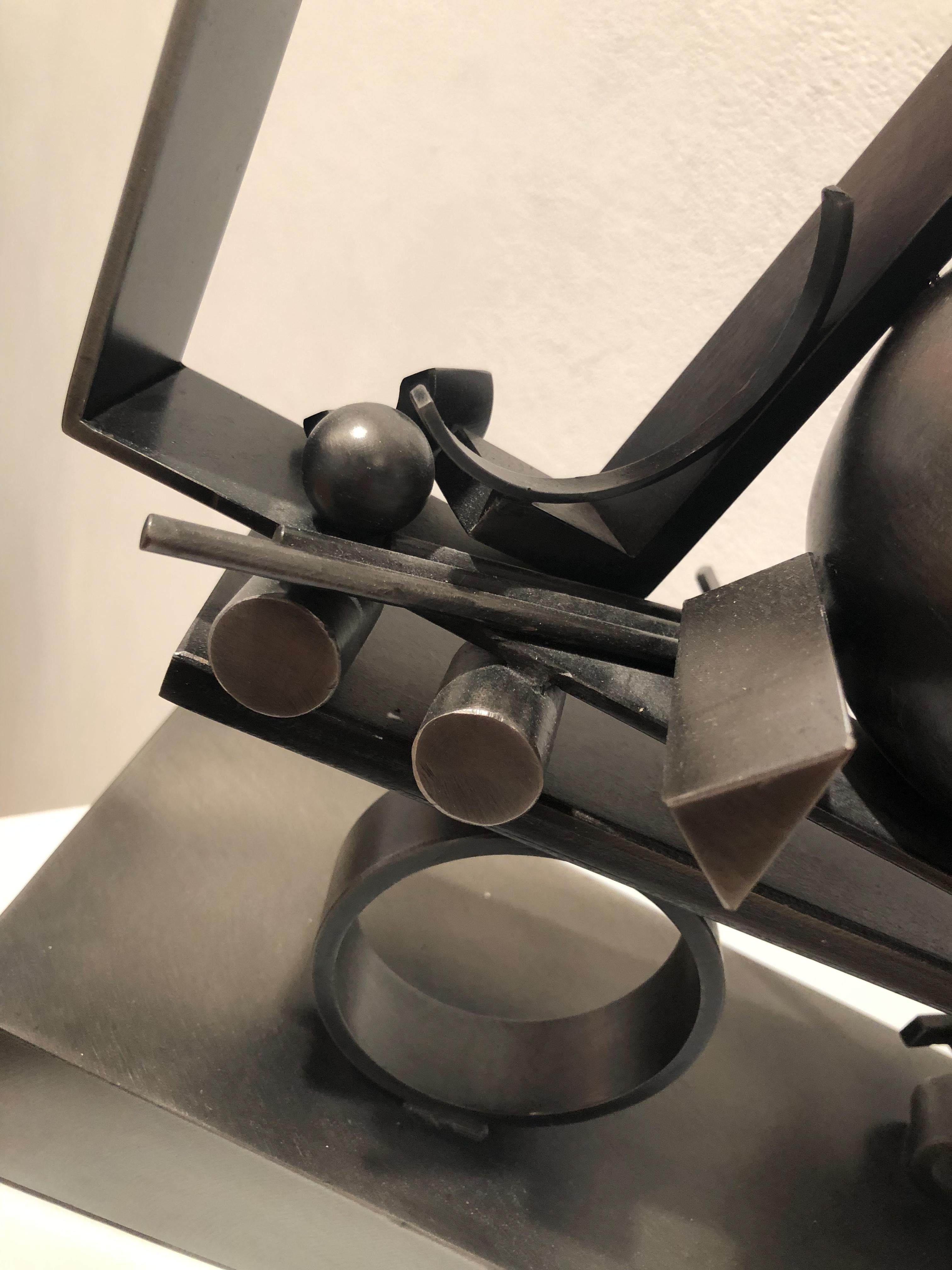 Fletcher Benton, Truckin Geo 21, 2000, black painted steel,  20 x 13 x 5 in

Abstract sculpture in painted steel with geometric circular and square forms

Fletcher Benton is well-known for his geometric metal sculptures. His sculpture often defies