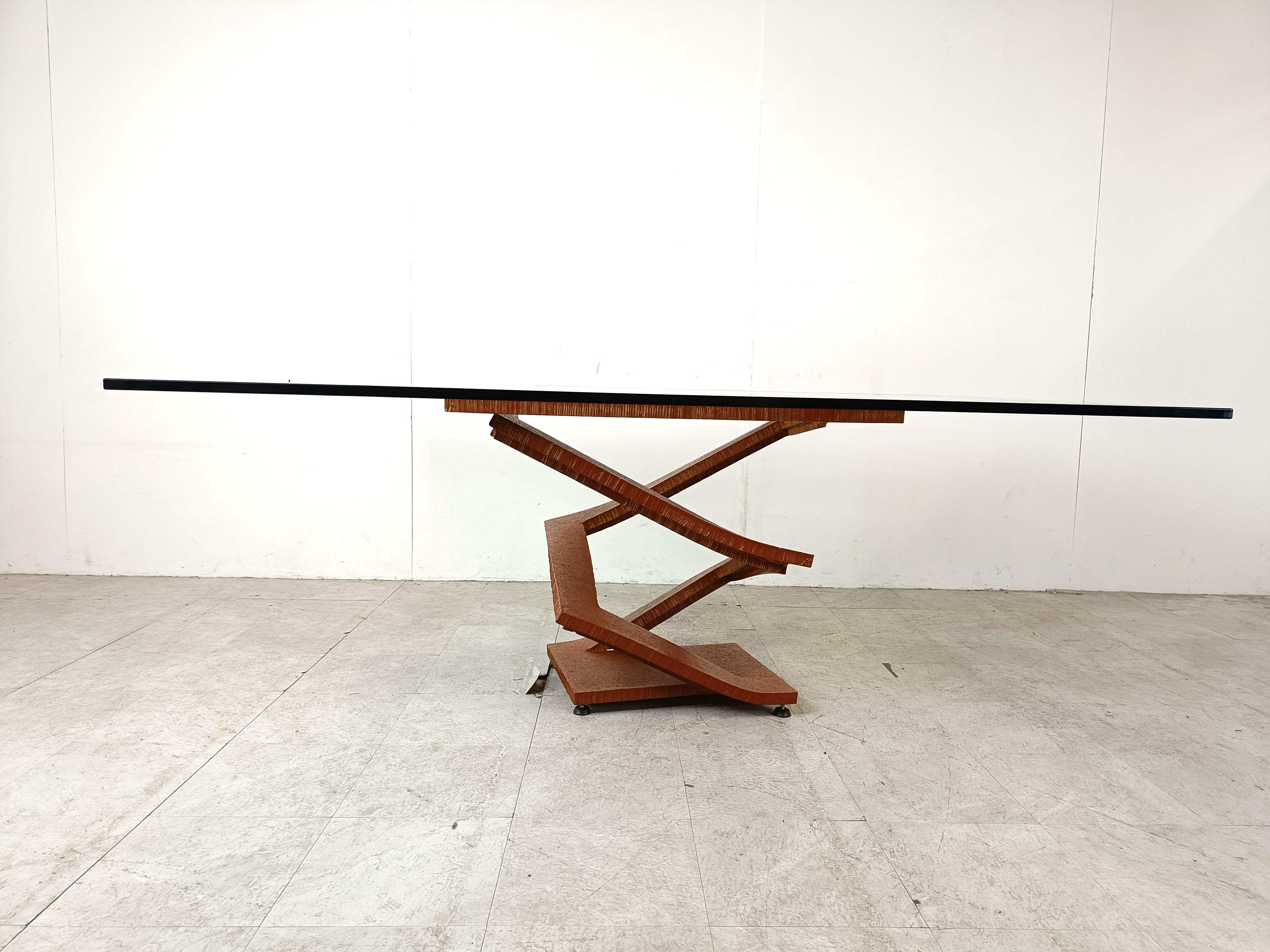 Impressive sculptural dining table consisting of a cut steel and bent base with a large rectangular glass top.

Striking and timeless design.

1990s - France

Good condition

Measurements:
Width: 190cm
Depth: 125cm
Height: 73cm

Ref.: 654114