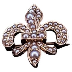 Spilla Fleur De Lis in oro 14k con perle di mare