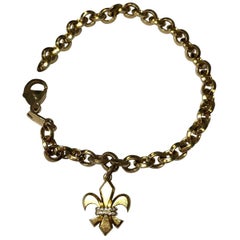 Fleur-de-Lis Charm Diamond and 18 Karat Yellow Gold Bracelet