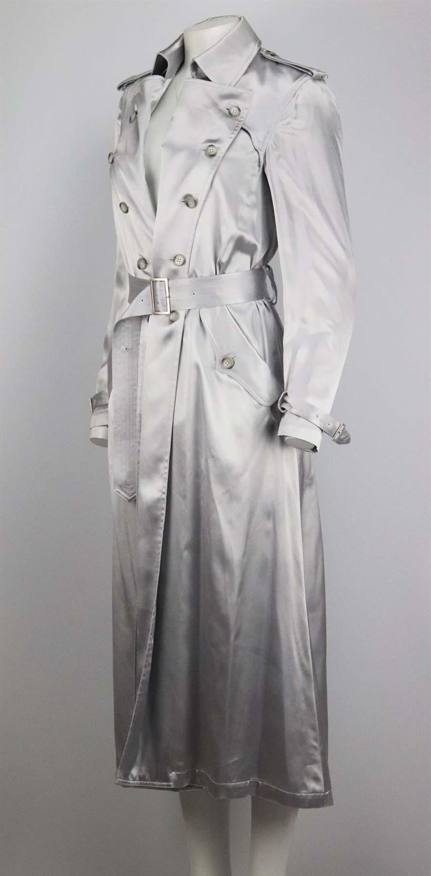 This trench coat by Fleur du Mal is made from lustrous silver satin that drapes beautifully and creates such an elevated vibe, it's designed in a slightly loose, double-breasted silhouette and has traditional shoulder epaulettes and buckle-fastening