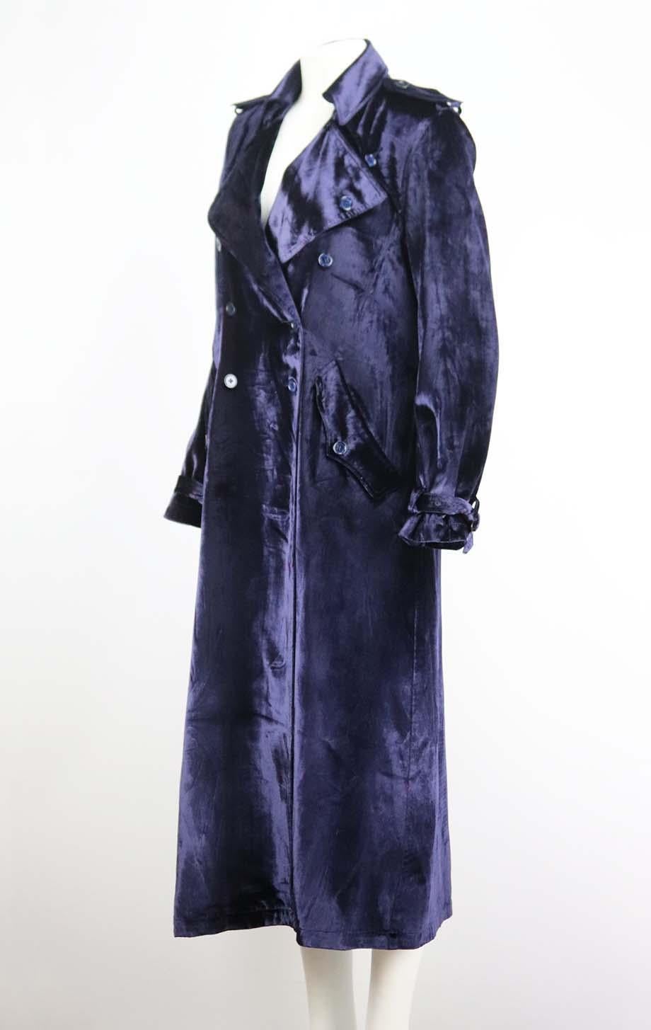 This trench coat by Fleur du Mal is made from luxurious navy velvet that drapes beautifully and creates such an elevated vibe, it's designed in a slightly loose, double-breasted silhouette and has traditional shoulder epaulettes and buckle-fastening