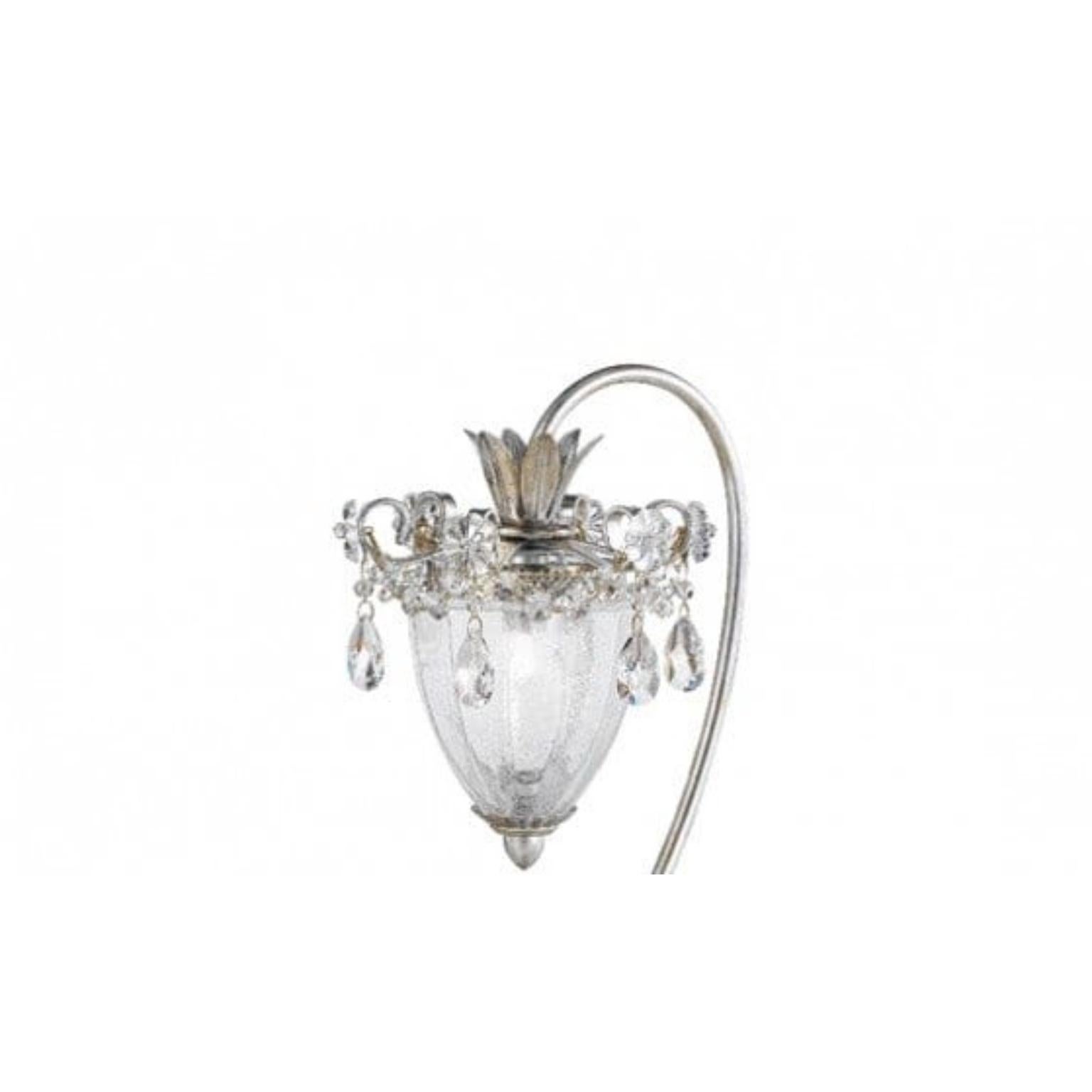 Lampe de table Fleur Rugiada par MM Lampadari
Dimensions : Ø 25 x H 40 cm : Ø 25 x H 40 cm. 
Matériaux : Métal et verre de Murano.

Toutes nos lampes peuvent être câblées en fonction de chaque pays. Si elle est vendue aux États-Unis, elle sera