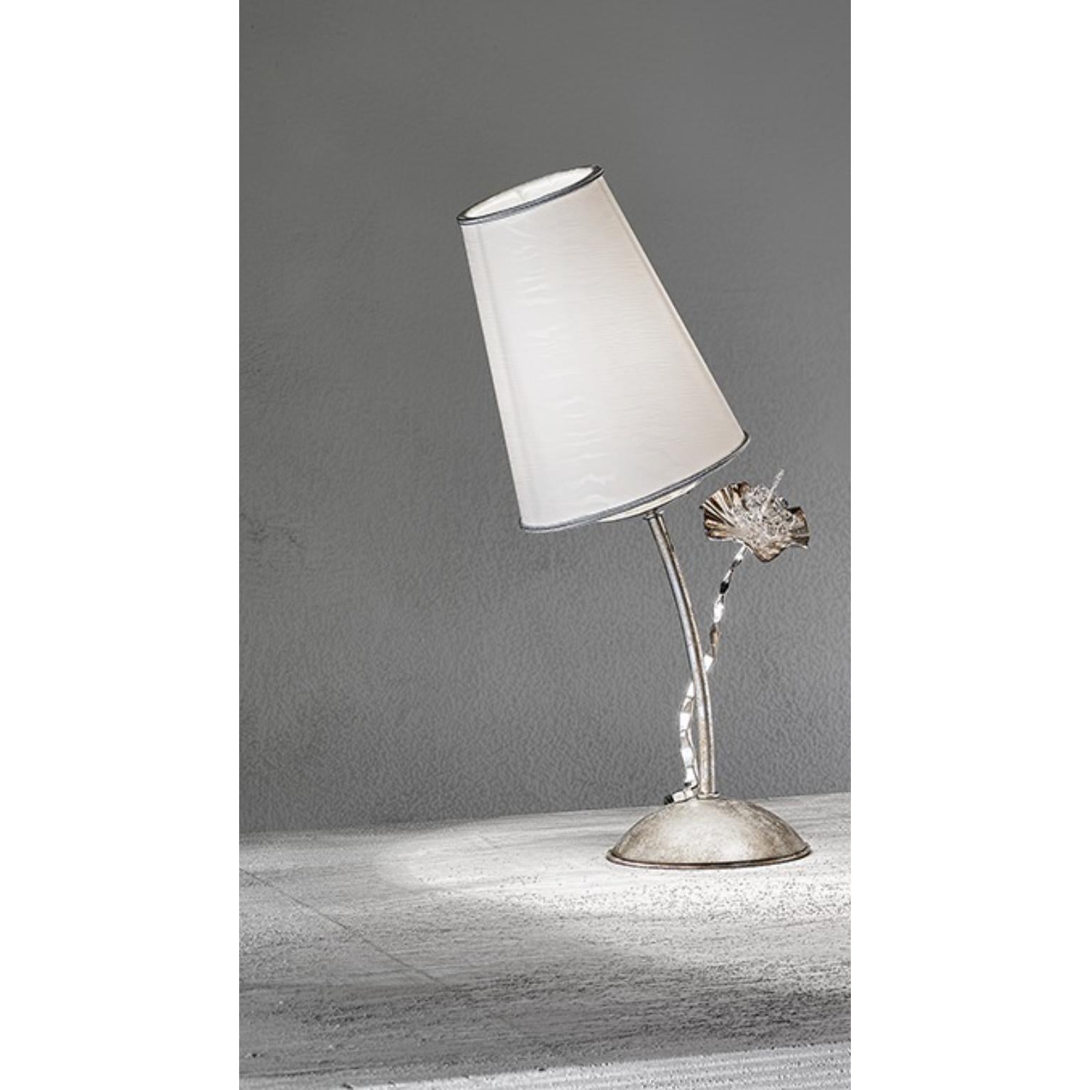 Fleur Stello Table Lamp by MM Lampadari
Dimensions: D 14 x W 18 x H 44 cm. 
Materials: Metal and fabric.

All our lamps can be wired according to each country. If sold to the USA it will be wired for the USA for instance. Please contact us.

An