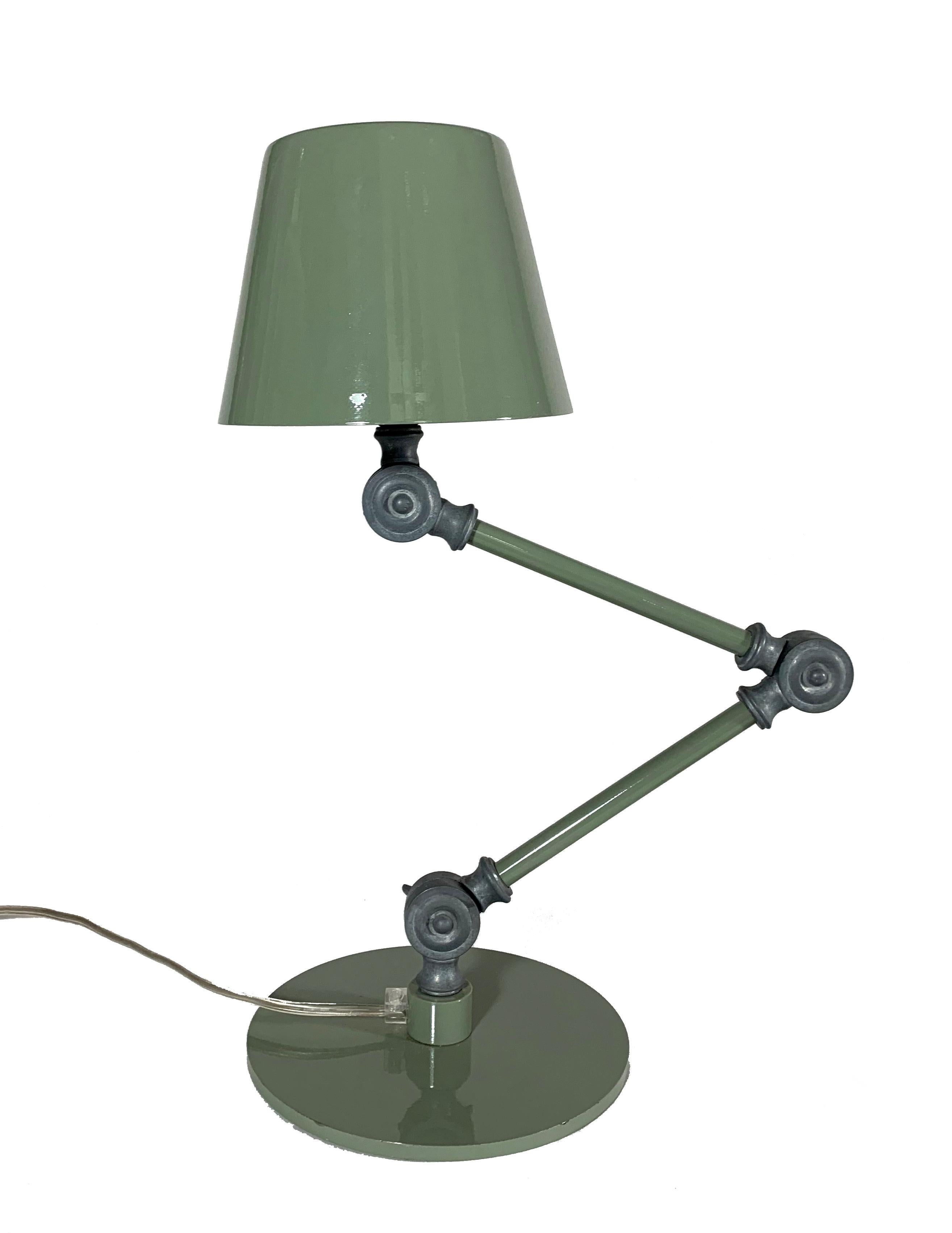 Adjustable table / accent lamp - single-section stem. Shown here in gloss military green. In-line switch on transparent cable. E14 lamp holder (bi-pin adapter available).
Made in Italy.