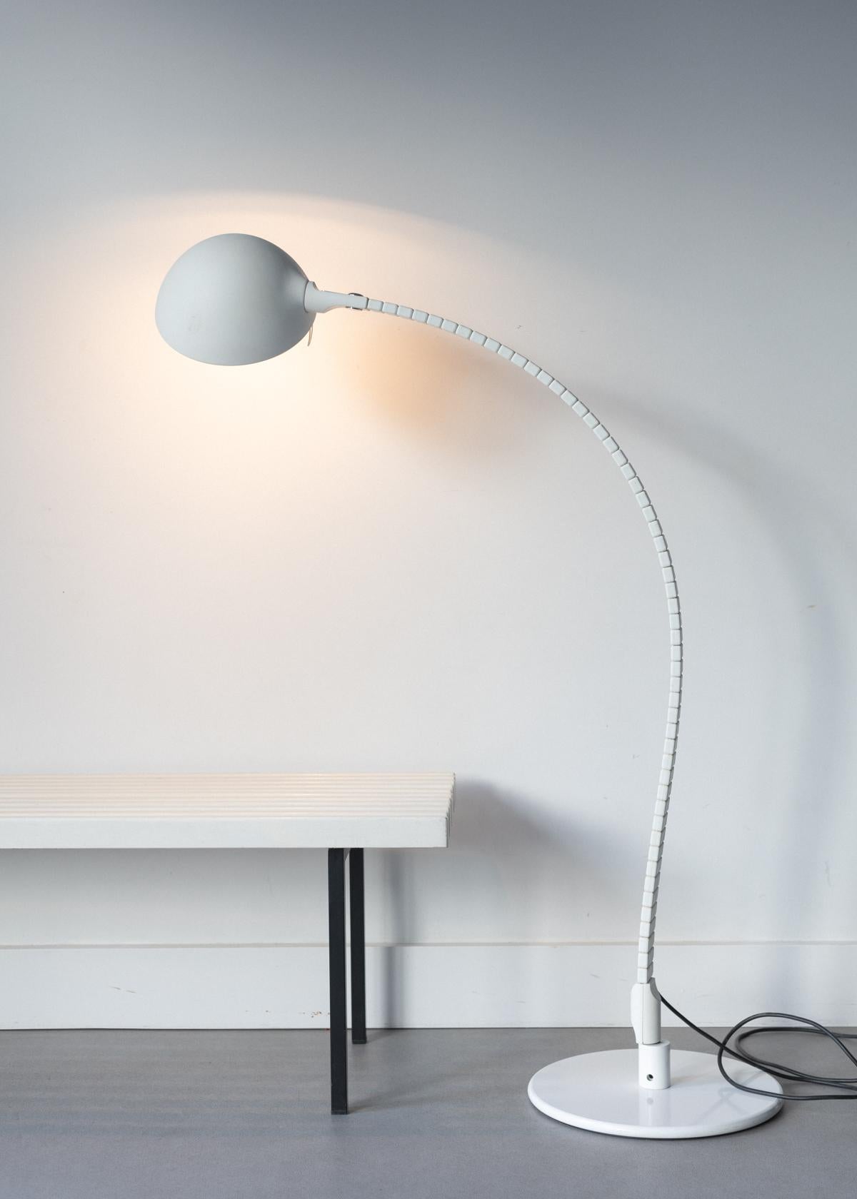 Discover the classic 60's look of the Flex Floorlamp by Elio Martinelli. Offering modern function with timeless style, this lamp is designed to adjust with your ever-changing needs - adjust the light with just one hand! With its sleek lines, classic