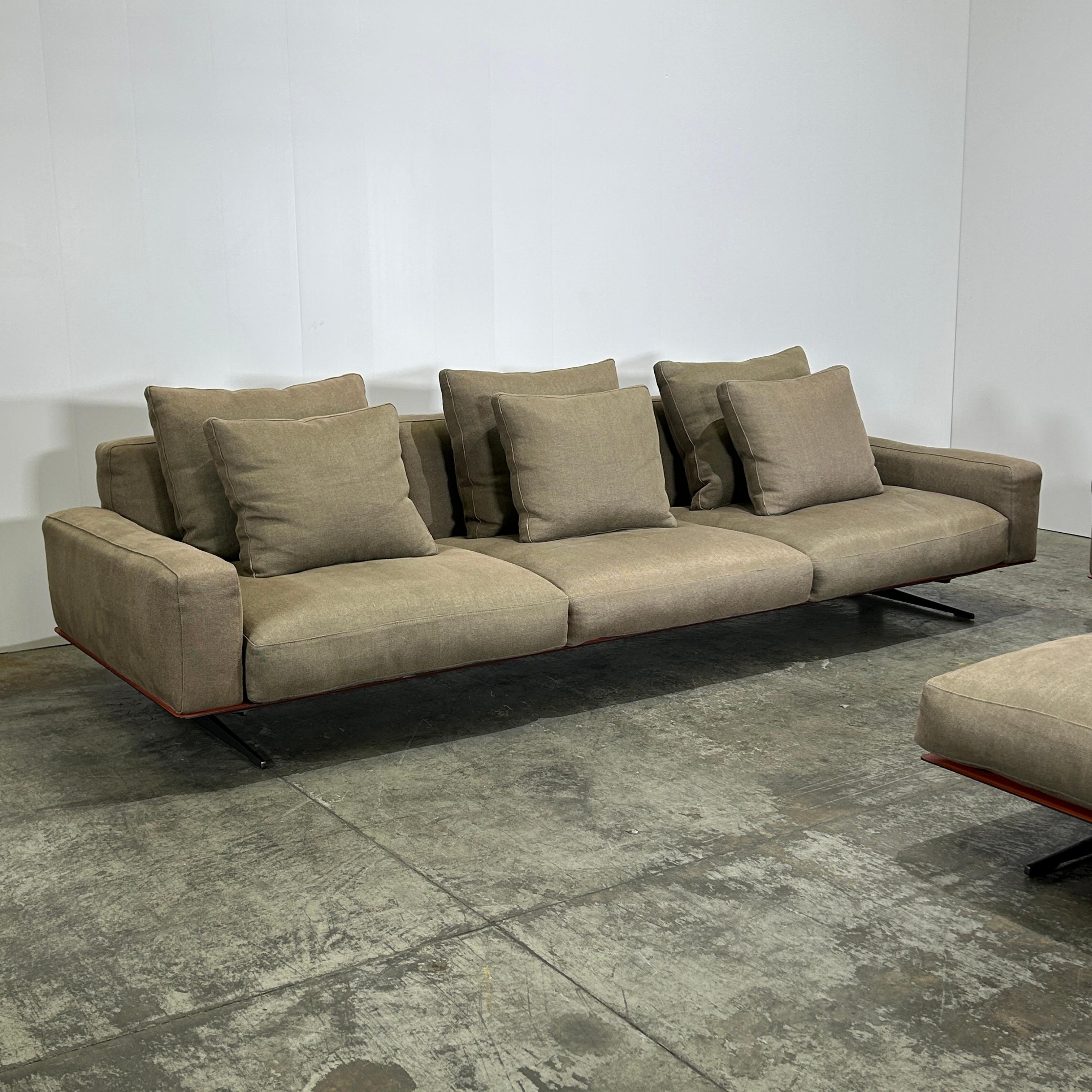 The Soft Dream by Flexform is the embodiment of refined comfort and contemporary elegance. Expertly crafted in Italy, this 3-seater sofa with matching ottoman combines clean lines with luxurious, inviting proportions. Its generously cushioned seats