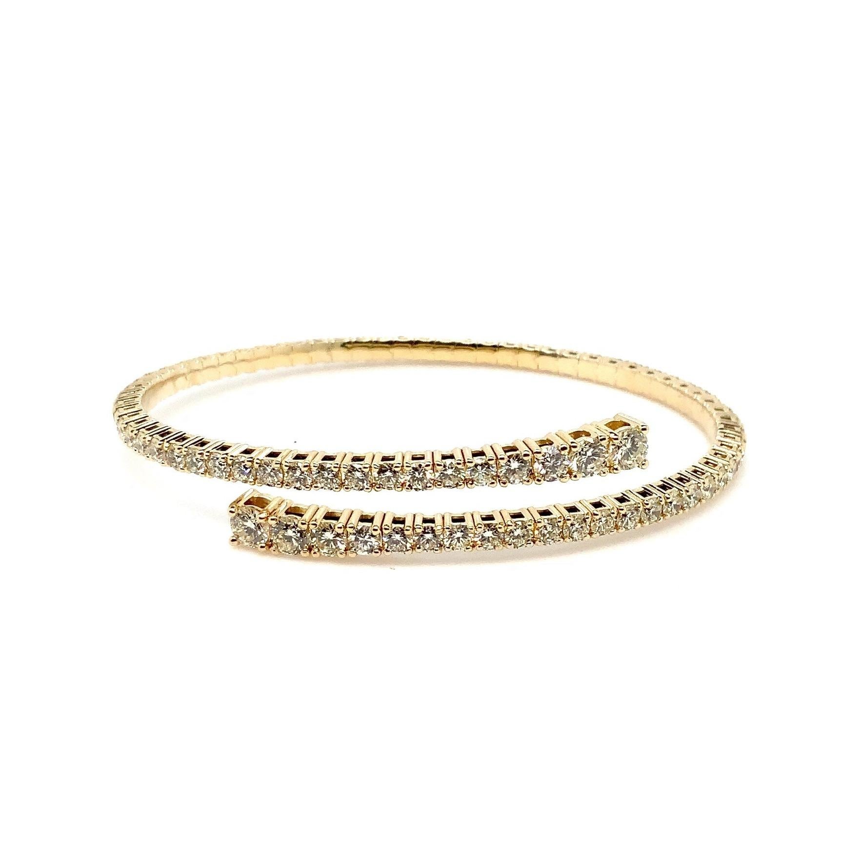 Experience the exquisite beauty of the Flexi Open By Pass Design Diamond Bangle Set, crafted in 14K Yellow Gold and featuring 79 Round Brilliant Cut Diamonds totaling 6.50 cts. tw. in graduating sizes. Each diamond boasts an impressive F-G color and