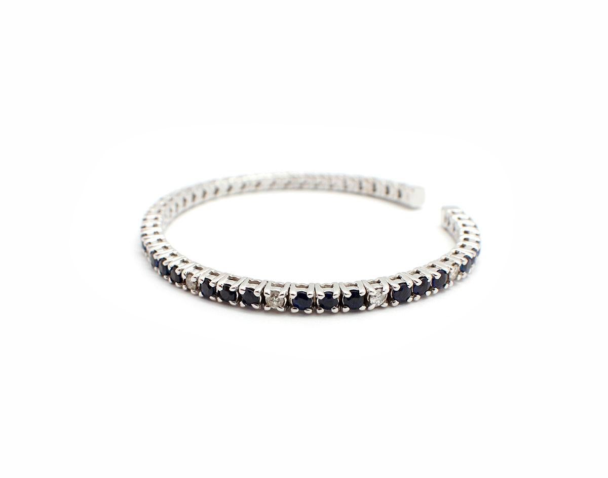 This gorgeous cuff is sure to dazzle! It features sapphires and diamonds set into a flexing 18k white gold cuff bracelet—easy to take on and off! The diamonds have a total weight of 0.66ct, and the sapphires have an additional weight of 5.00 carats.
