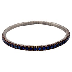Flexible 18 Karat Rose Gold Blue Sapphires Titanium Bracelet