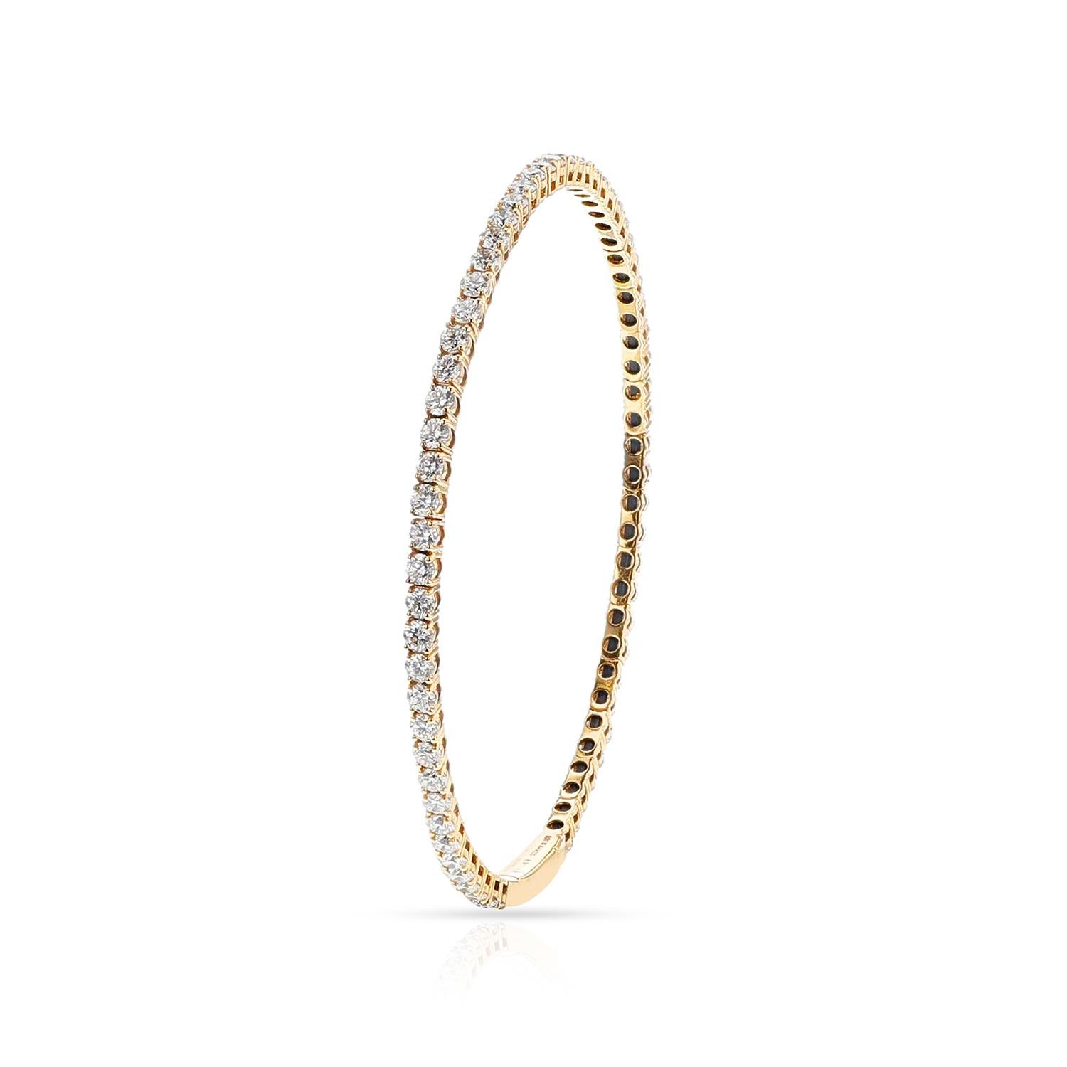A Flexible Diamond Bangle with 3.93 cts. of Diamonds made in 18k Yellow Gold. The clarity is VS2/SI1, and the color is G/H.  The total weight of the bangle is 7.36 grams. The diameter is 2.25