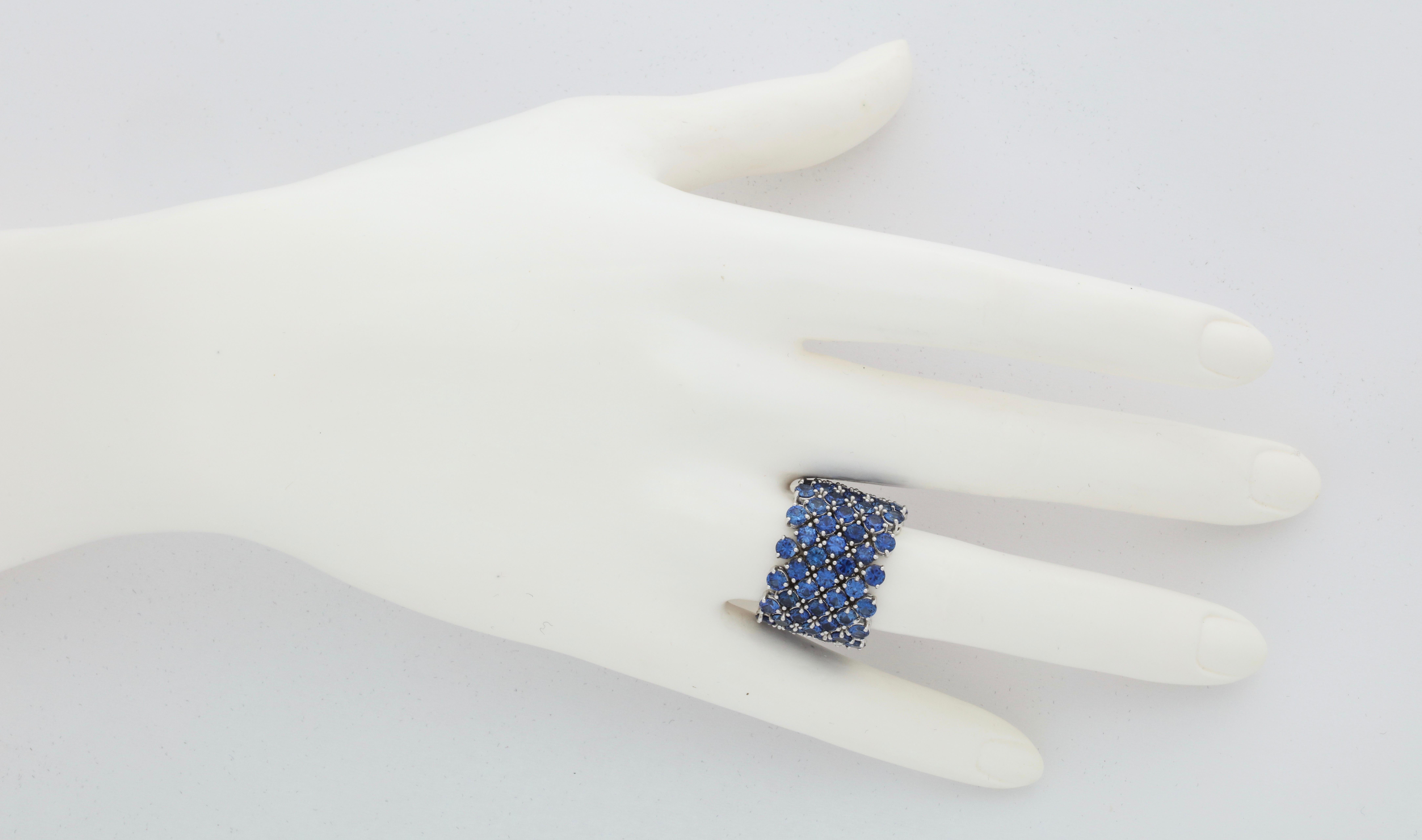 This ring is simply the most flexible, comfortable, colorful and elegant wide band that you will ever own.  Once you experience the effect of such superior craftsmanship you will be smitten.   Seven rows containing 98 perfectly matched bright, blue