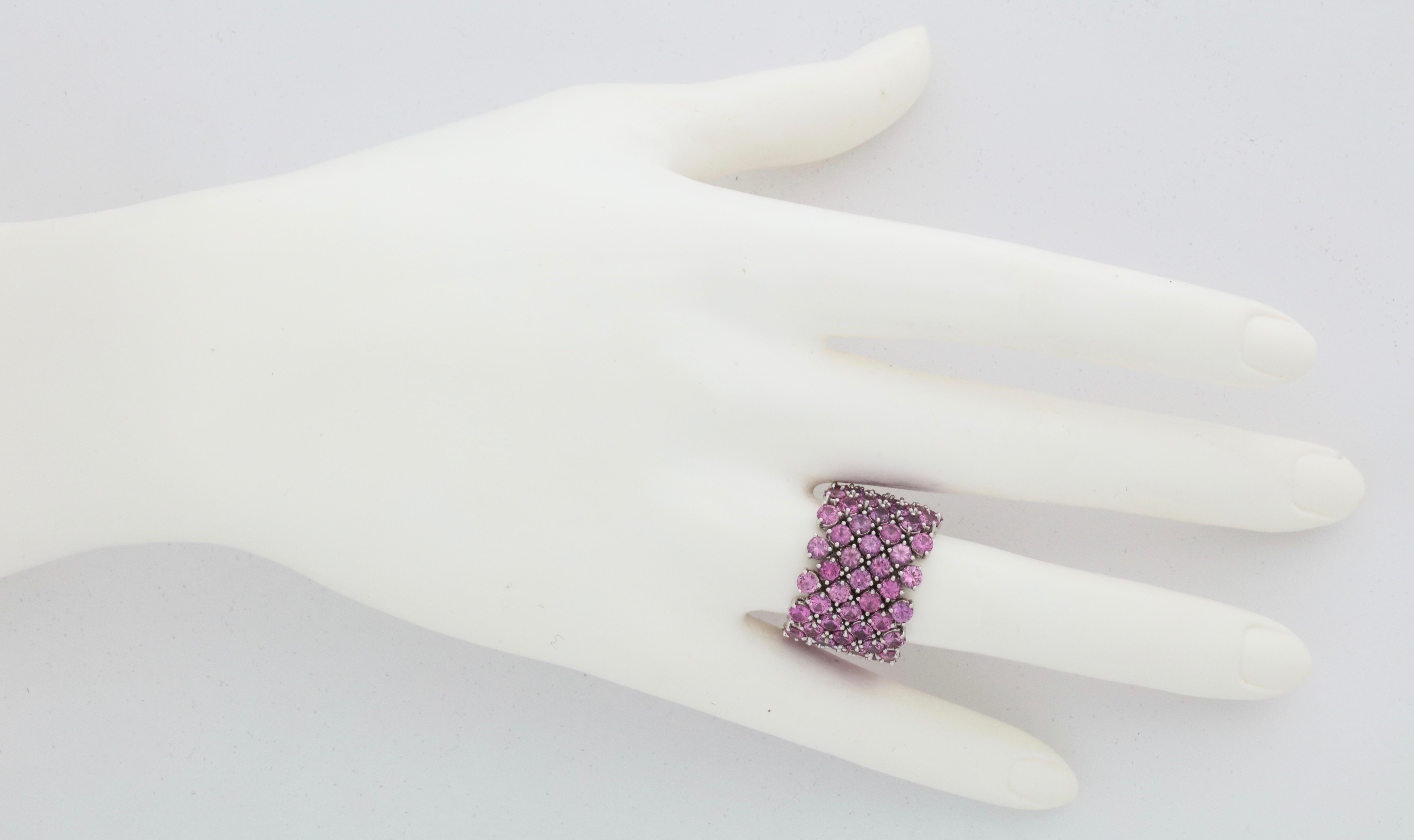 This ring is simply the most flexible, comfortable, colorful and elegant wide band that you will ever own.  Once you experience the effect of such superior craftsmanship you will be smitten.   Seven rows containing 98 perfectly matched stones weigh