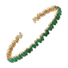 Bracciale flessibile in oro 18 carati con smeraldo baguette