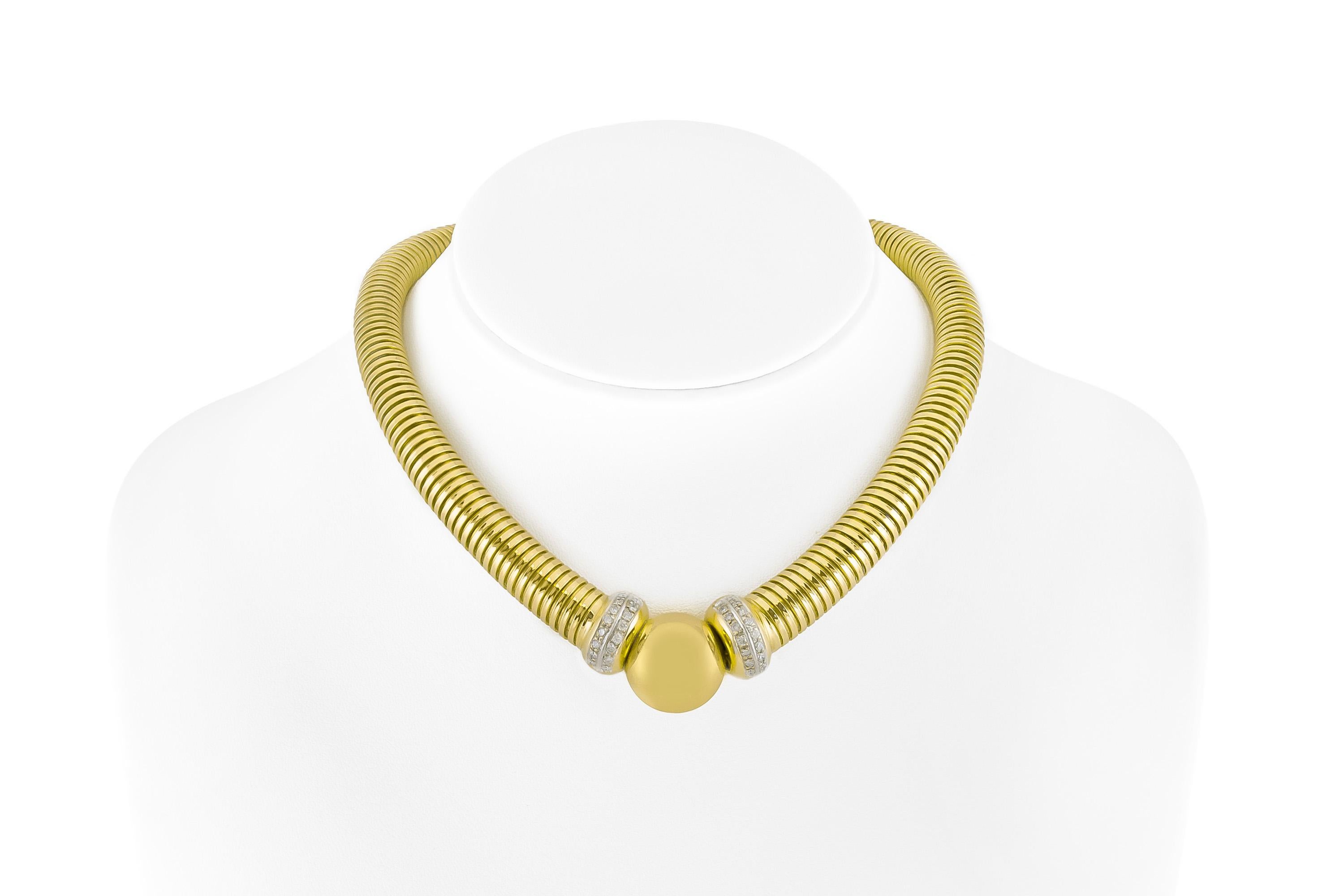 The neckalace is finely crafted in 18k yellow gold with diamonds in the center of the necklace weighing approximately total of 1.40.
Circa 1970.