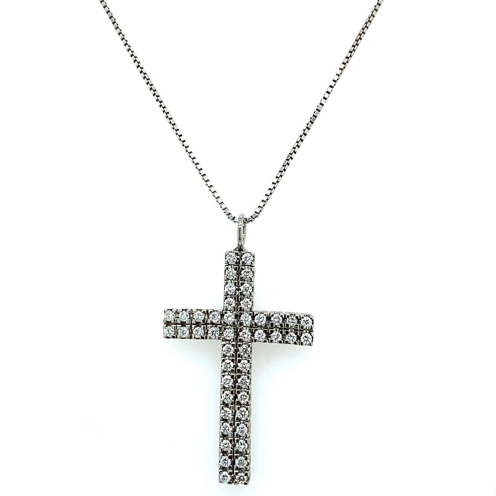 This delicate 18ct White Gold Diamond cross, features a total of 1.0ct F-G/VS round brilliant cut Diamonds, suspended on an 18ct White Gold chain. This pendant is a perfect gift for your loved ones.

Additional Information: 
Total Diamond Weight: