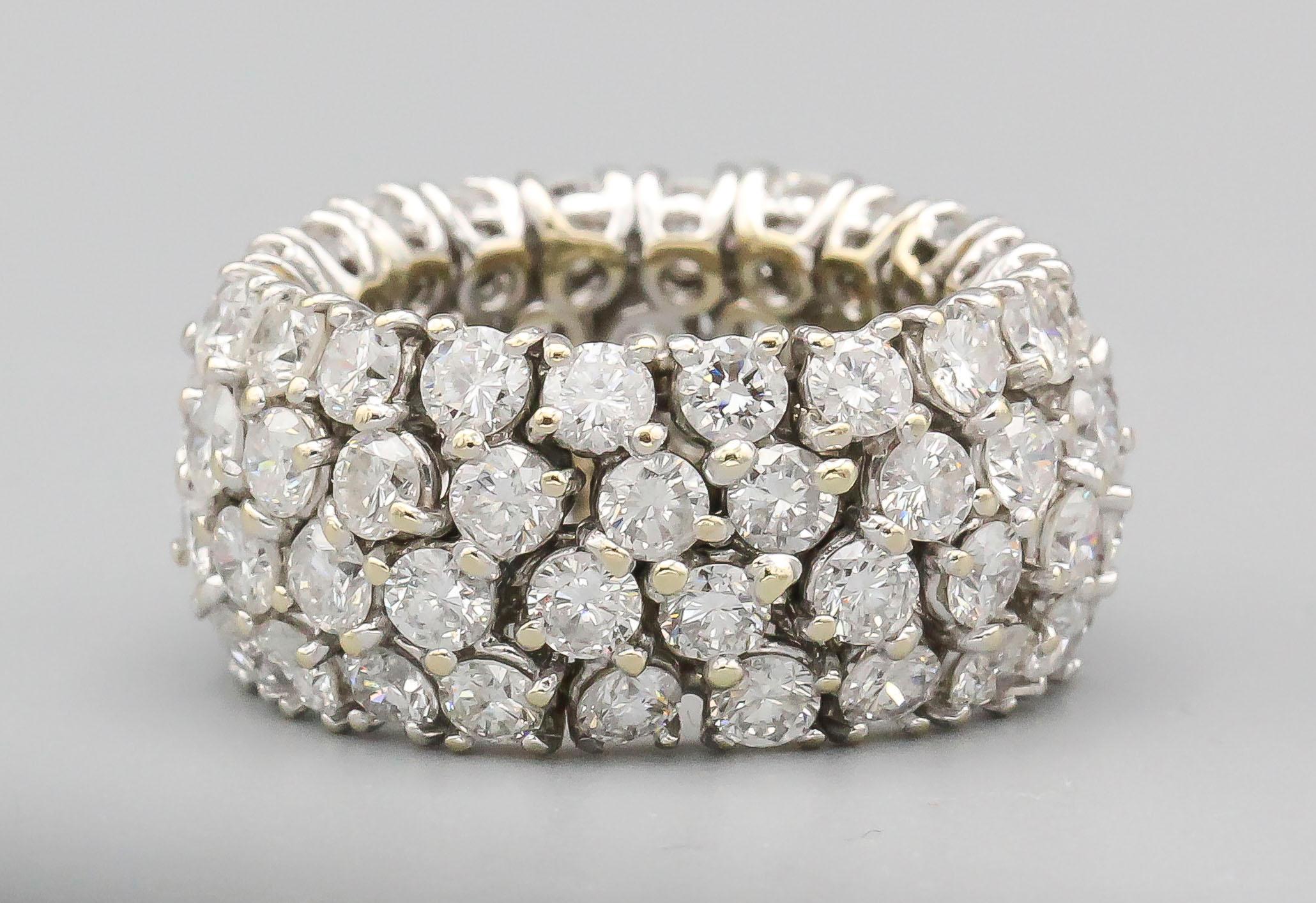 Fine diamond and 18k white gold band of flexible design.  Features approx. 6.5-7.0 carats of round brilliant cut diamonds of high color and clarity.  The 