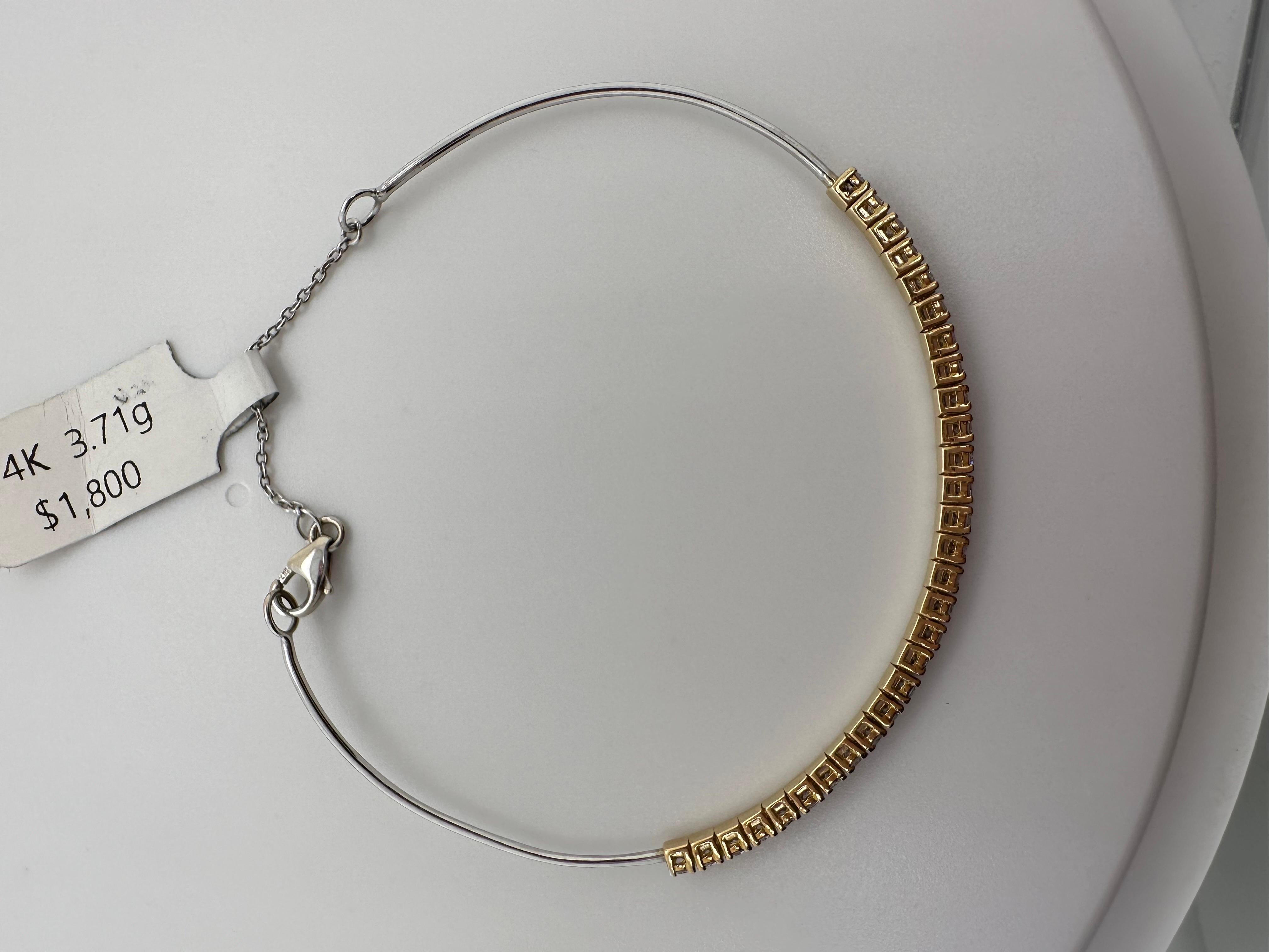 Flexible bangle bracelet with natural diamonds in 14KT gold!

Metal Type: 14KT
Gram Weight:3.71 grams 

Natural Diamond(s): 
Color: G
Cut:Round Brilliant
Carat: 0.45ct
Clarity: VS-SI (average)
Item: T1800
Certificate of authenticity comes with