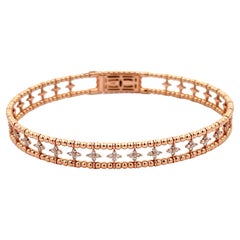 Bracelet souple à motif de fleurs en or rose 14 carats et diamants