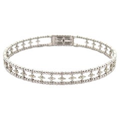Bracelet souple à motif de fleurs en or blanc 14 carats et diamants