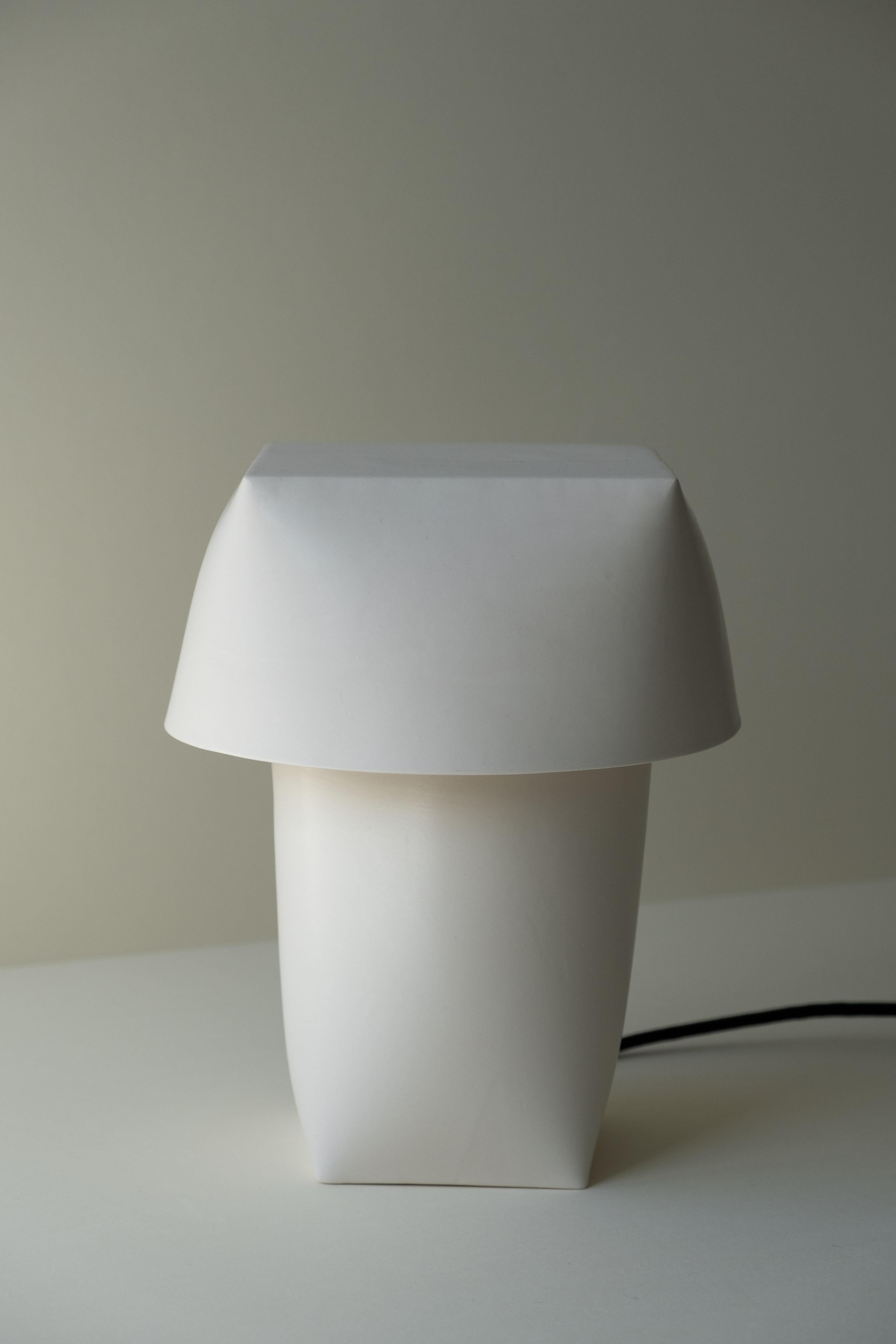 Flexible Formed Table Lamp by Rino Claessens
Dimensions: D 20.5 x W 20.5 x H 25 cm.
Materials: Glazed ceramic, stainless steel and electric components.
Finish: Ivory glaze.
Technical Specification :
E27 fitting. 4,8W 220V-240V 2700K mat bulb