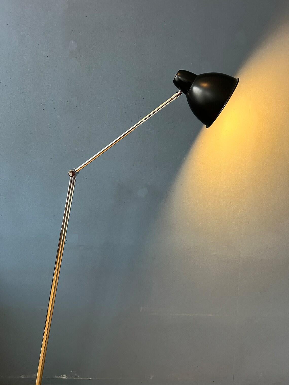 Unique mid century Hala zeist floor lamp. The lamp is extremely flexible. It can be adjusted at the base, in the middle of the chrome arm and the shade itself. This way the light can be positioned in any way desirable. For this reason the base is