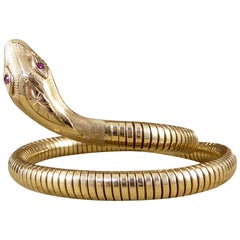 Flexible Snake Bangle Bracelet in 9 Carat Yellow Gold with Garnet Set Eyes